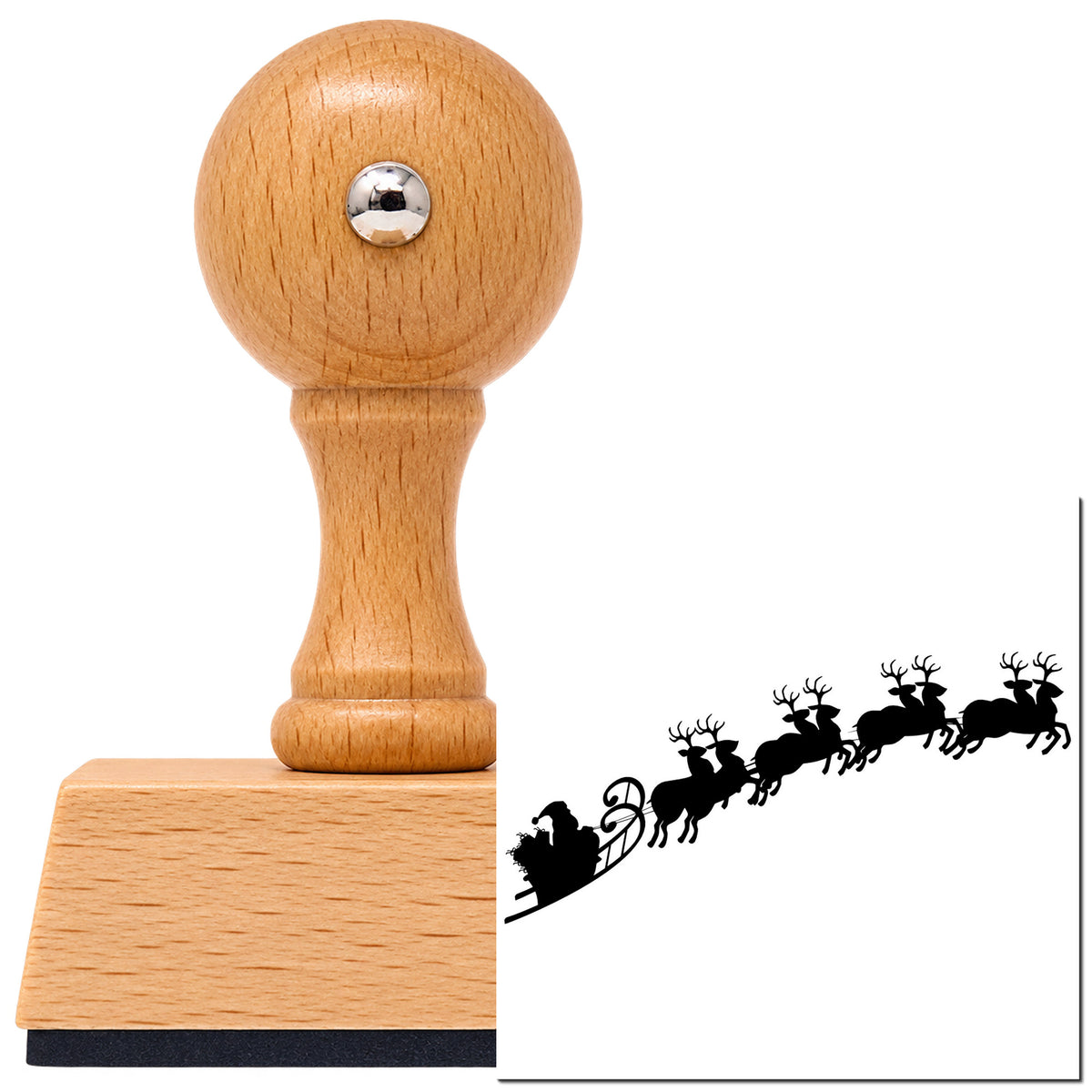 Reindeer And Santa Sleigh Scene Vintage Pro rubber stamp in European beech wood with a round knob handle, shown beside its black imprint.
