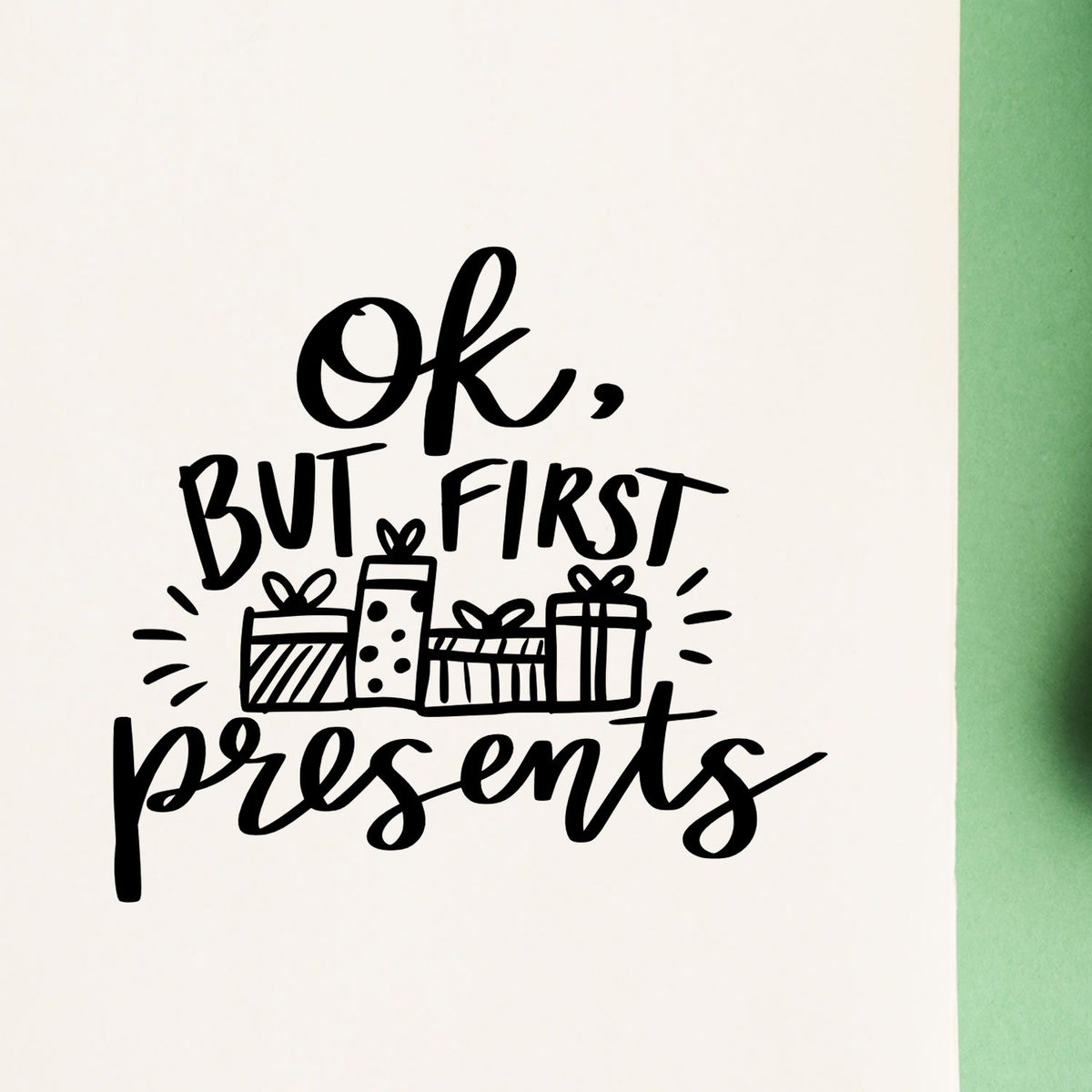 OK But First Presents Pre-Inked Stamp – PSI imprint stamped in black ink. “Ok But First Presents” features a row of wrapped gifts and radiating strokes.