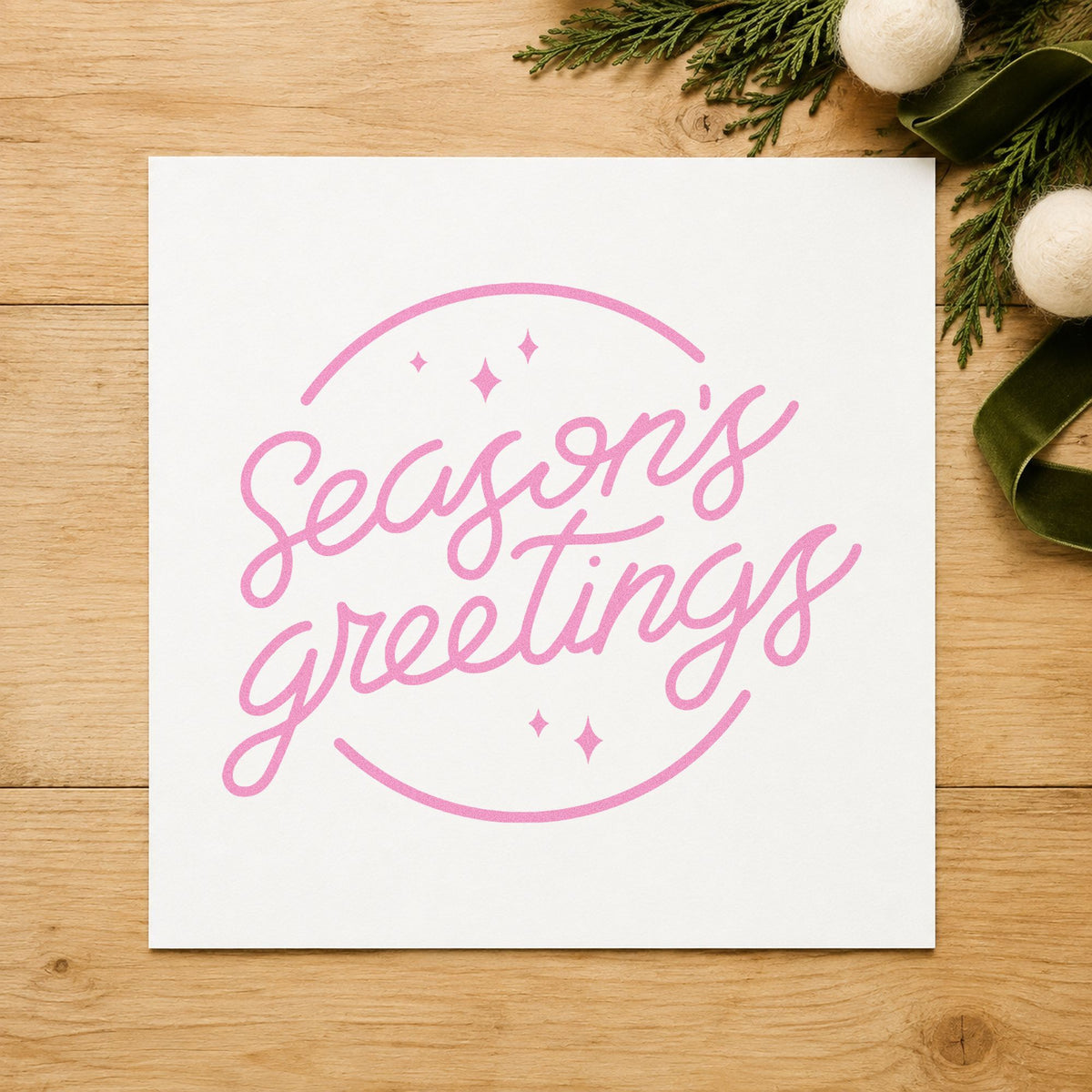 Season's Greetings Circle craft stamp in purple ink on cardstock, an easy option for client gift tags.