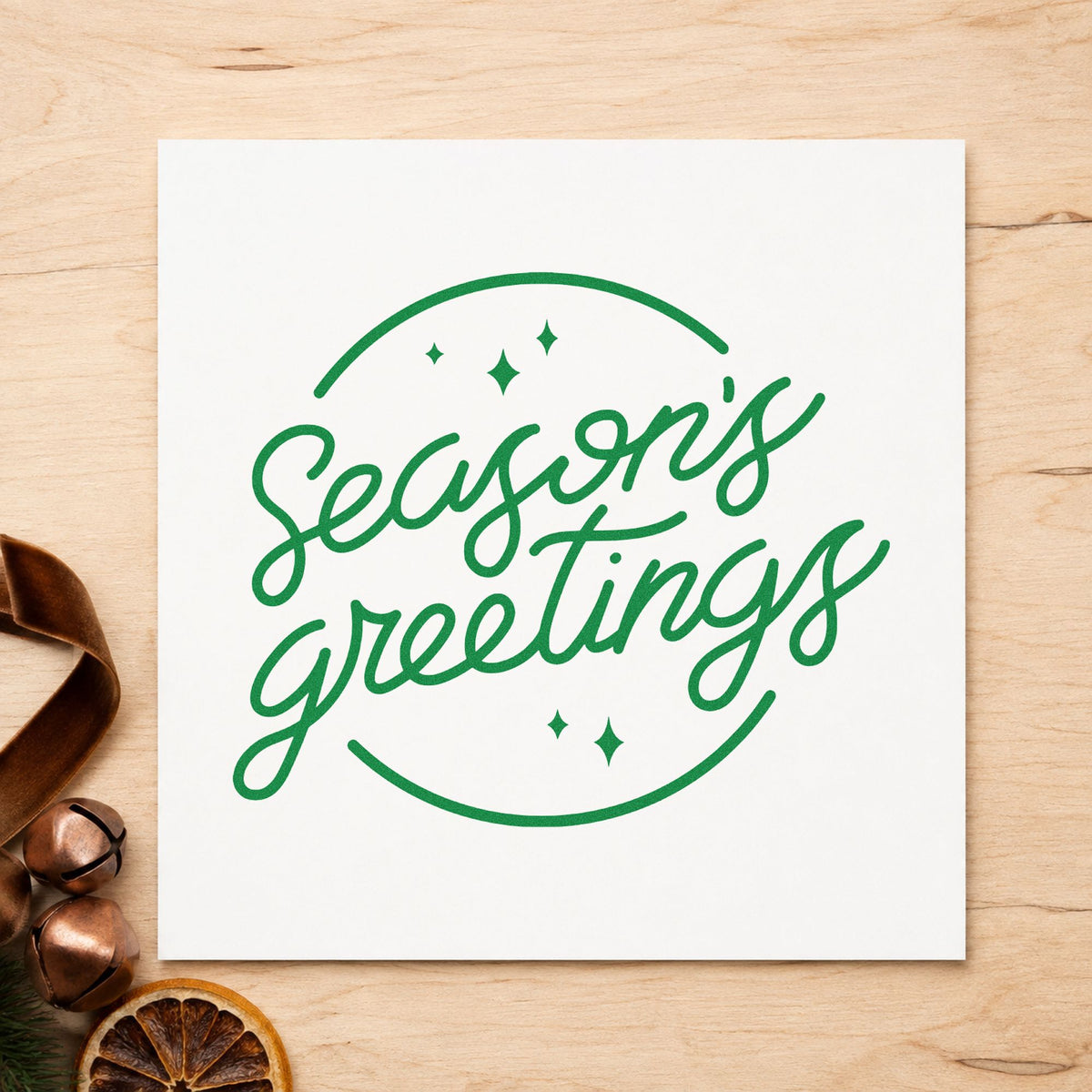 Season's Greetings Circle craft stamp imprint in green ink on a handmade project, one idea being mailing list pages.