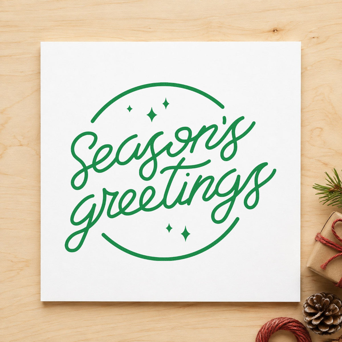 Season's Greetings Circle craft stamp imprint in green ink on a handmade project, one idea being framed reception desk.
