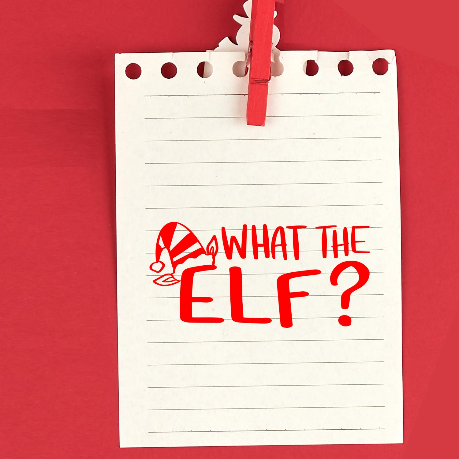 Holiday rubber stamp design reading What the Elf? with elf hat graphic for Christmas cards and crafts.