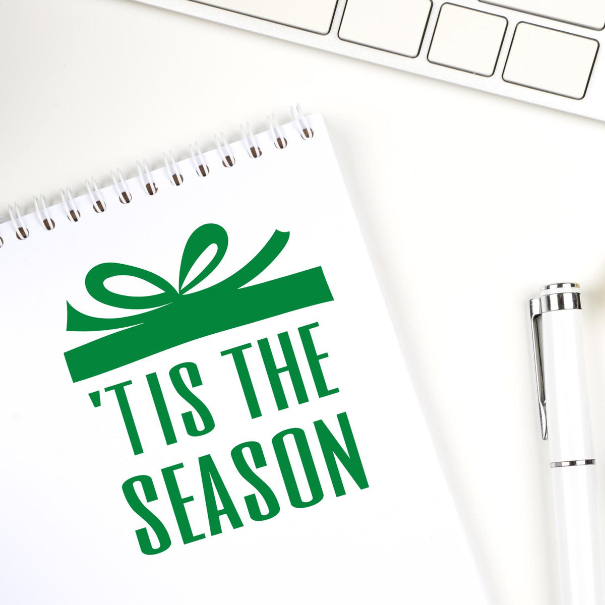 Holiday rubber stamp design with Tis the Season gift bow graphic, ideal for festive cards, packaging, and branding.