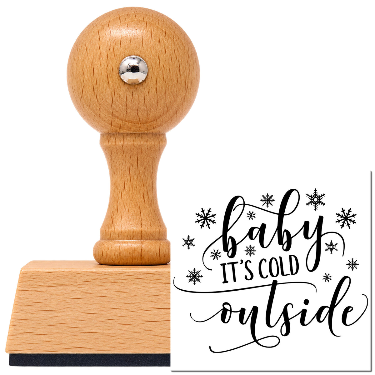 Baby It's Cold Outside Vintage Pro rubber stamp in European beech wood with a round knob handle, shown beside its black imprint.