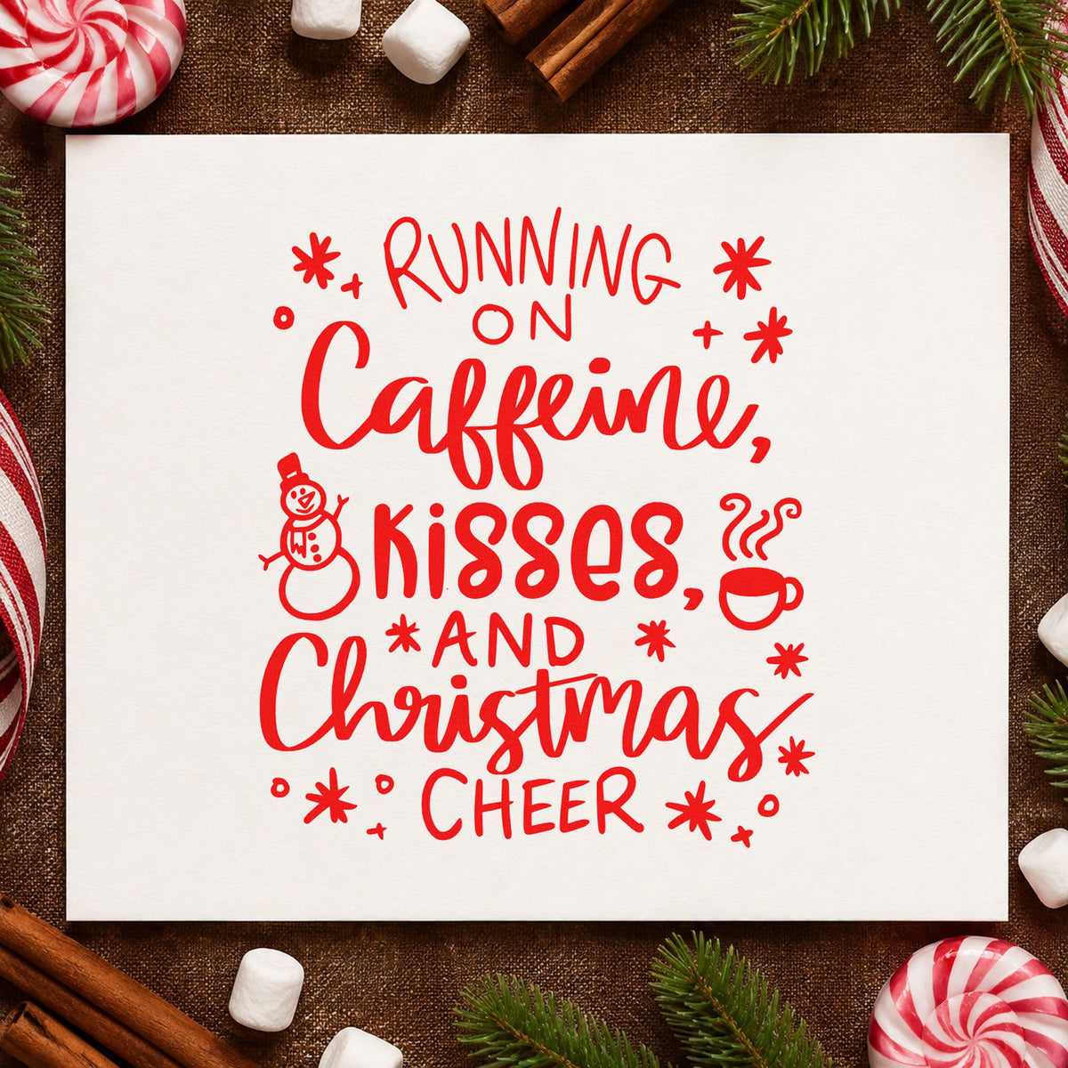 Caffeine Kisses Christmas Cheer rubber stamp shown in red ink, stamped for projects such as tumbler lid stickers.