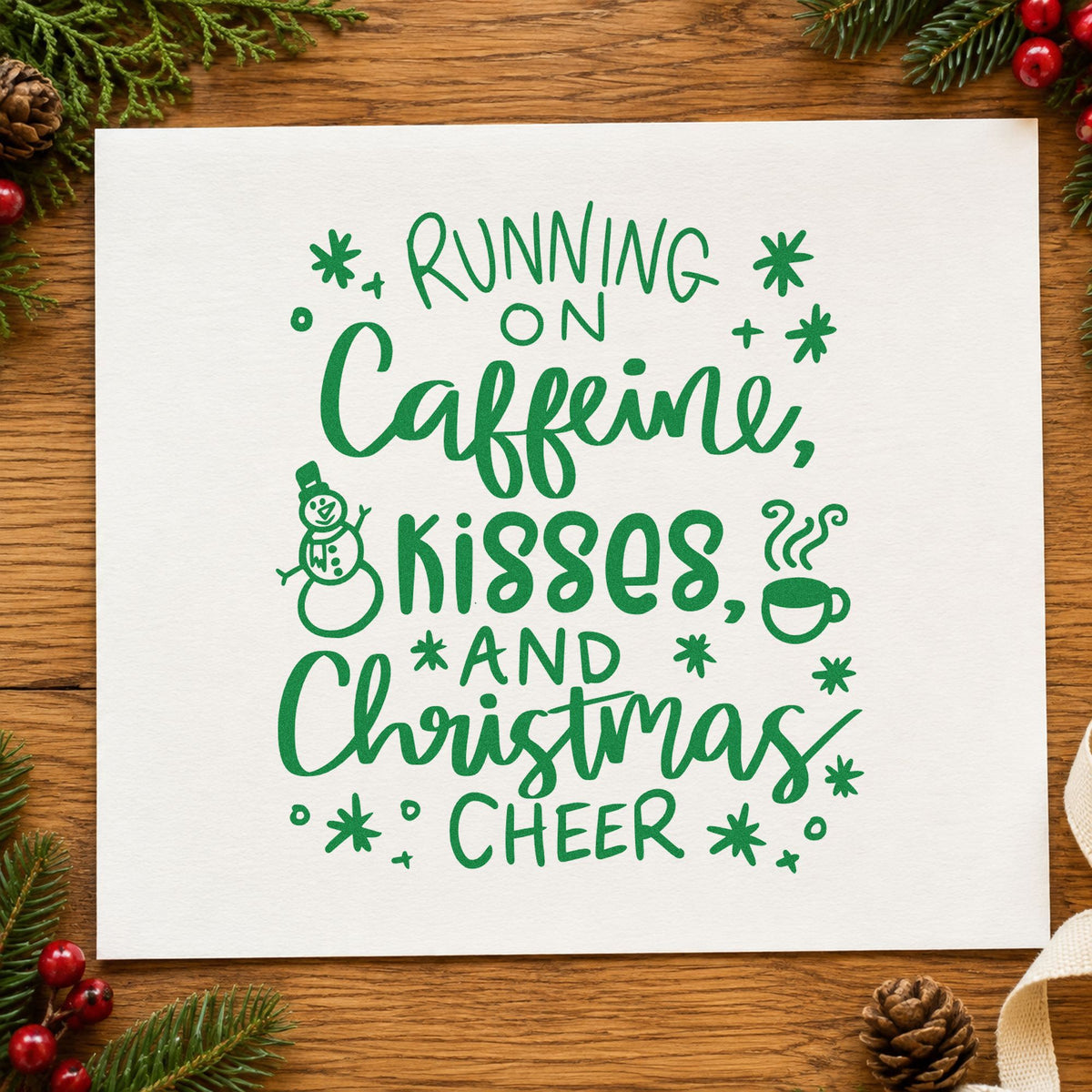 Caffeine Kisses Christmas Cheer craft stamp imprint in green ink on a handmade project, one idea being cookie swap invites.