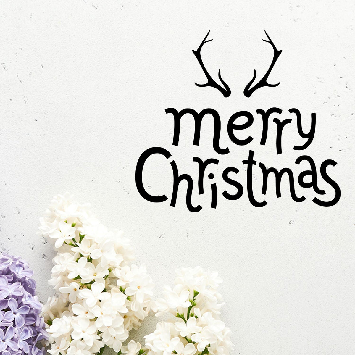 Merry Christmas rubber stamp with antlers and floral accents for holiday cards