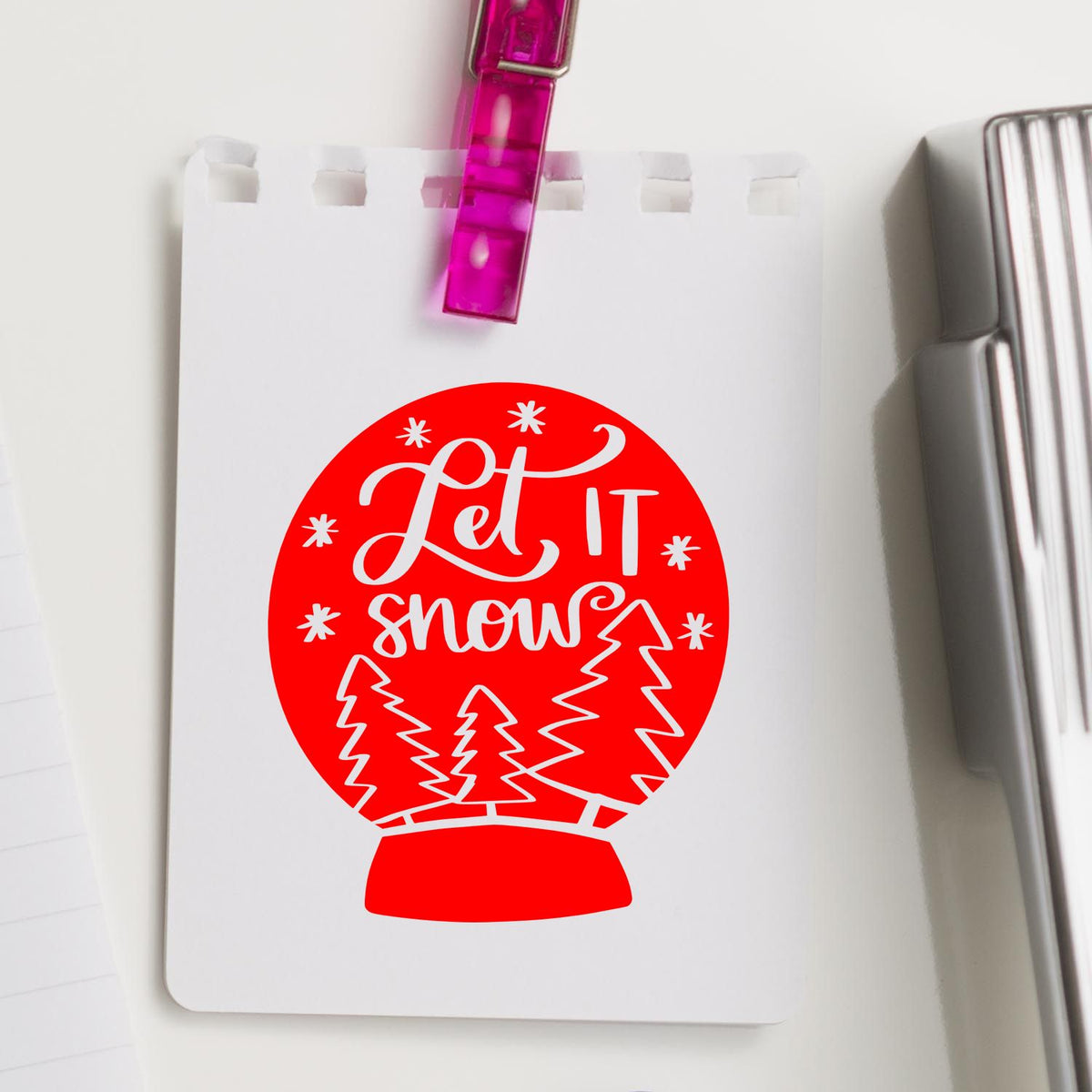 Let It Snow Snow Globe rubber stamp shown in red ink, stamped for projects such as ski trip album page.