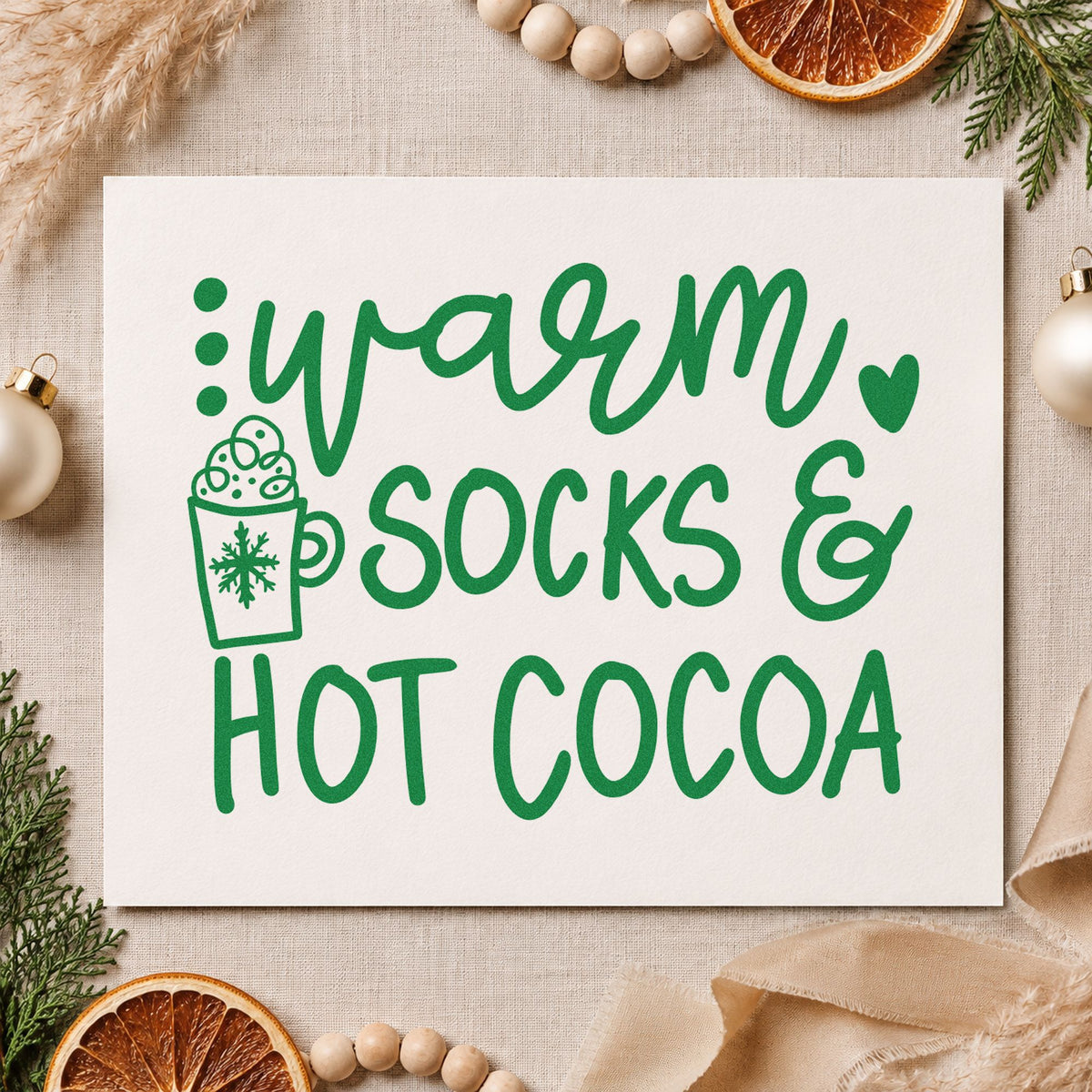 Warm Socks And Hot Cocoa craft stamp imprinted in green ink on paper, a design suited to framed den corner.