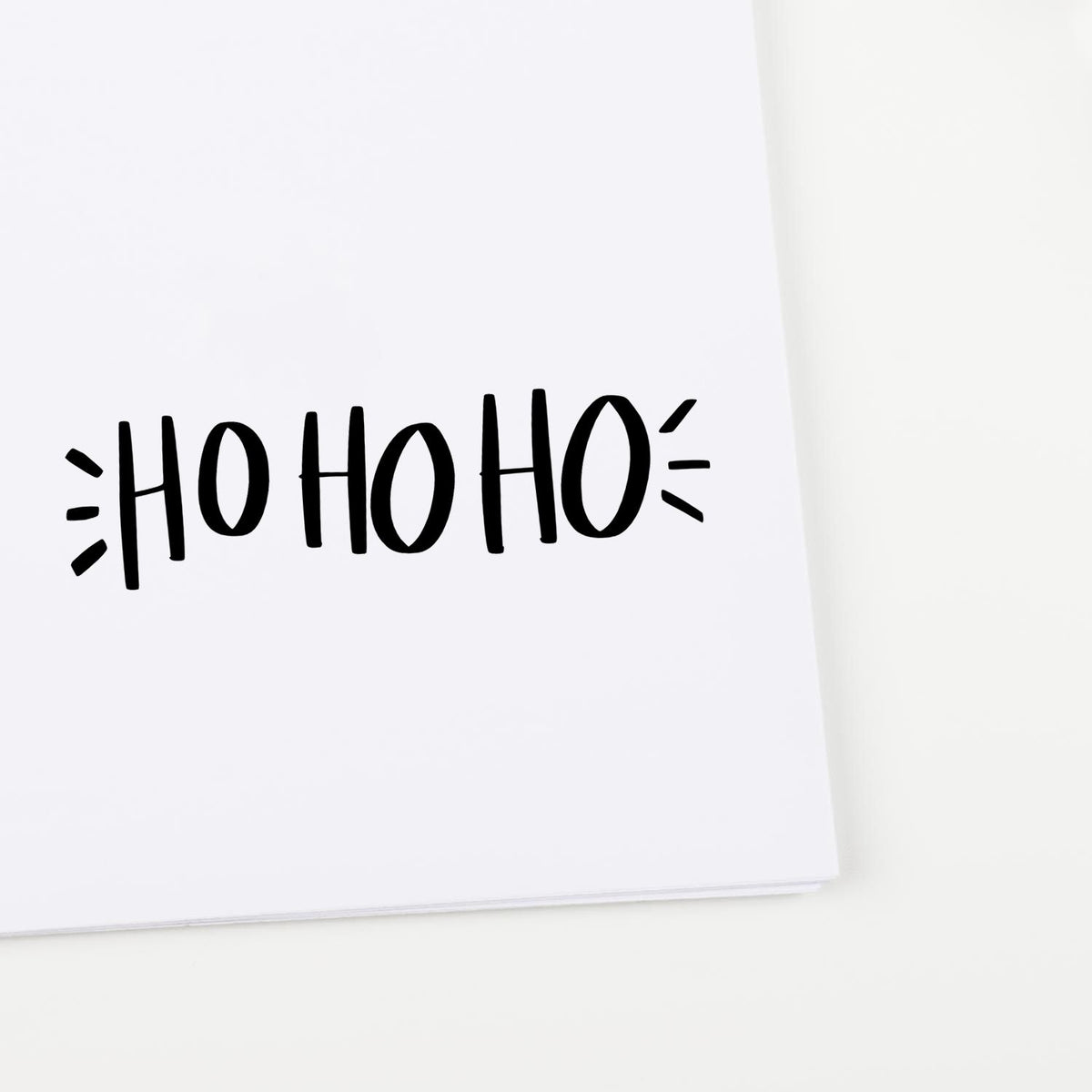 Ho Ho Ho holiday rubber stamp design in bold black lettering for Christmas cards, gift tags, and festive craft projects.