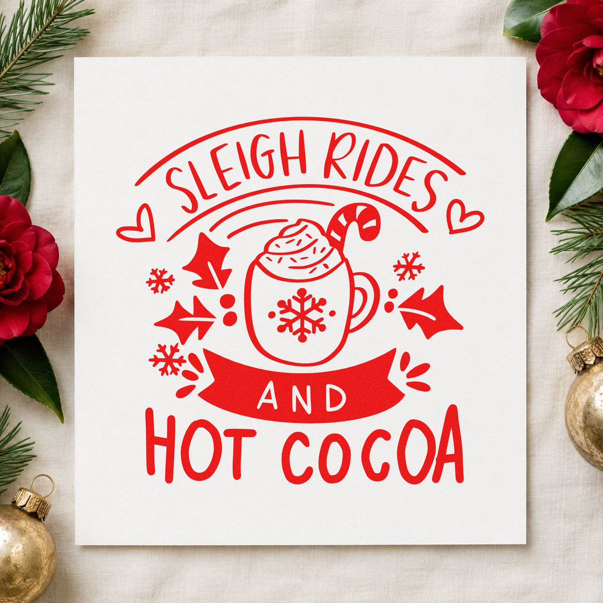 Sleigh Rides And Hot Cocoa craft stamp in red ink on cardstock, an easy option for lap blanket ink.
