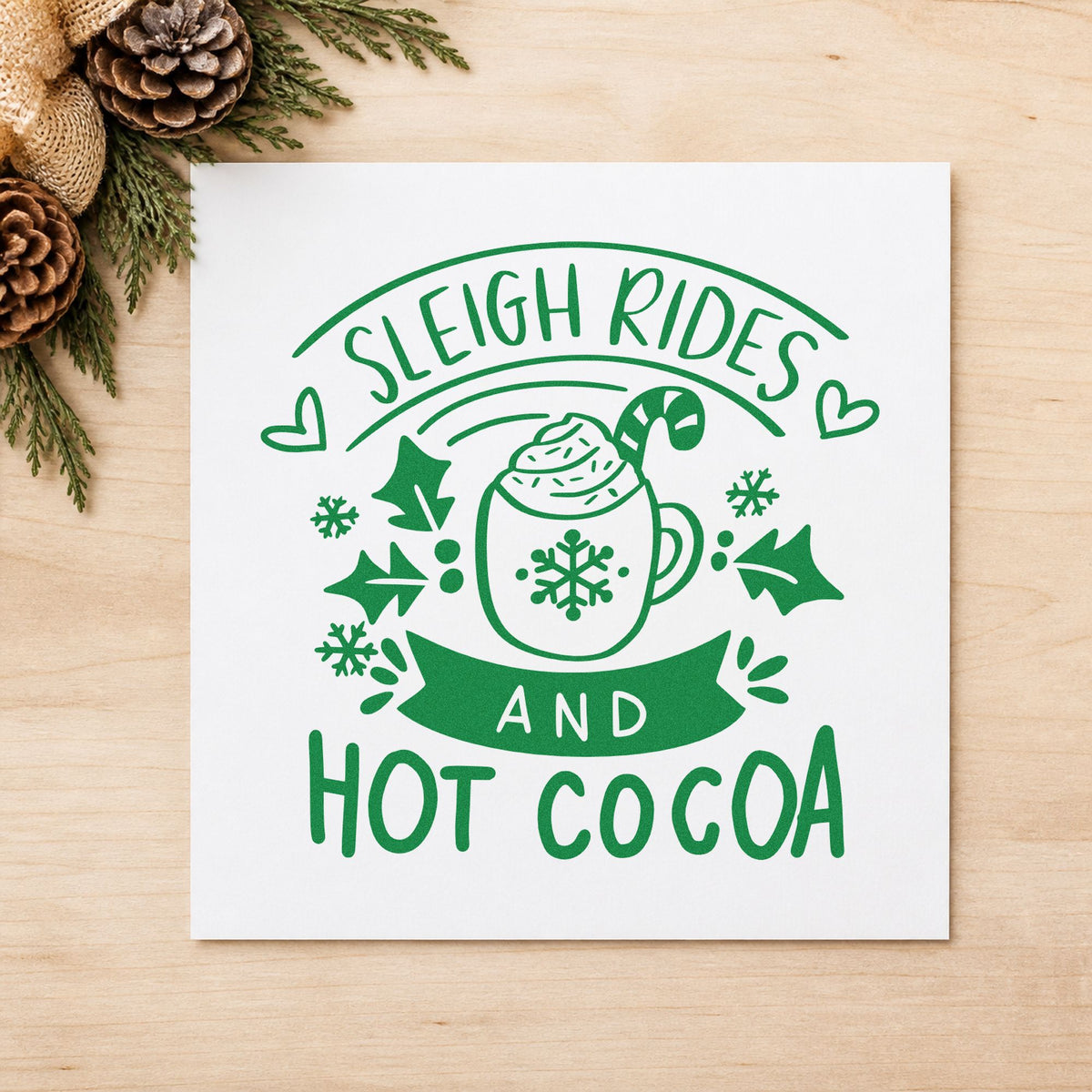 Sleigh Rides And Hot Cocoa craft stamp imprint in green ink on a handmade project, one idea being hayfield ticket stubs.