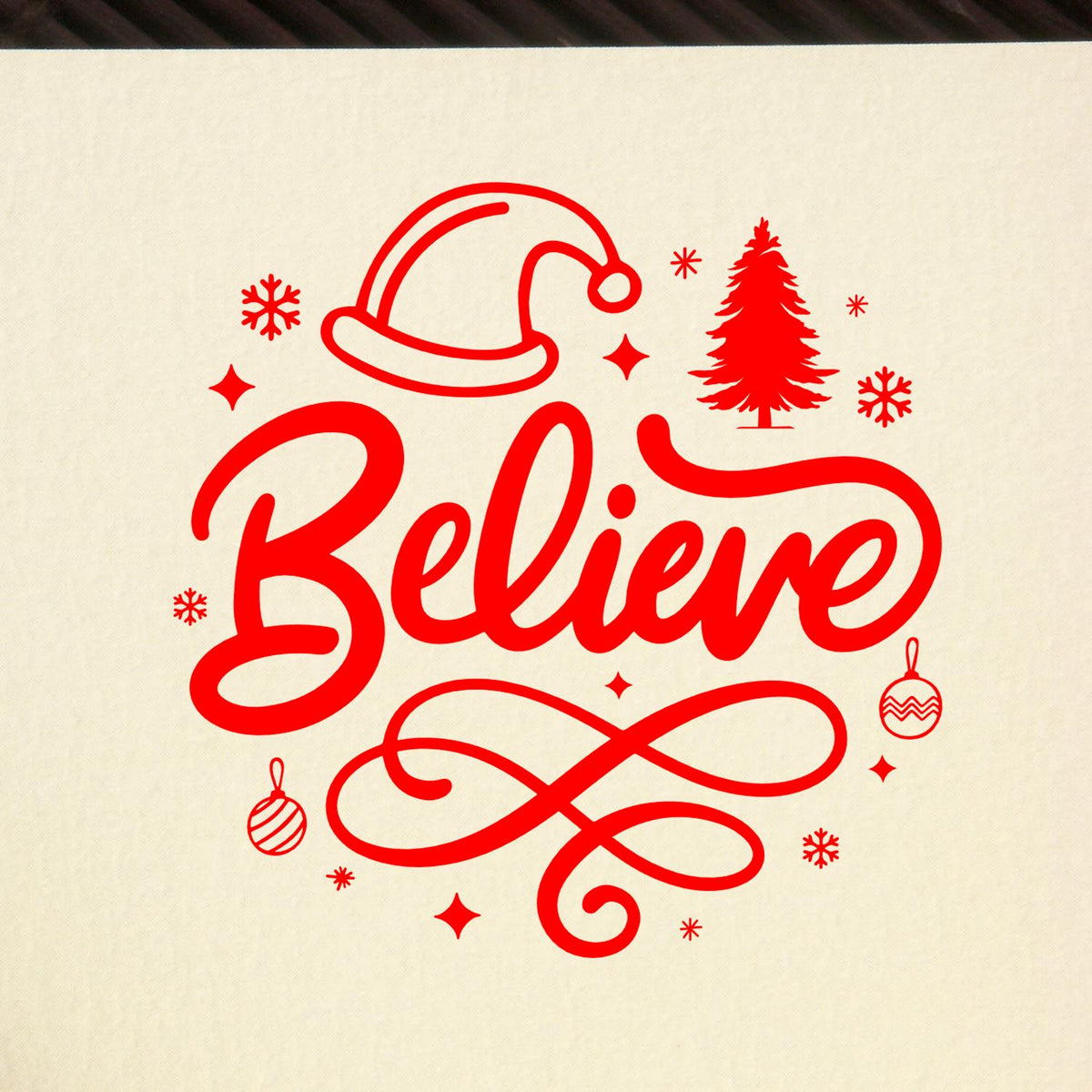 Christmas rubber stamp design with Believe in red script, Santa hat, tree, snowflakes and ornaments for holiday crafts.