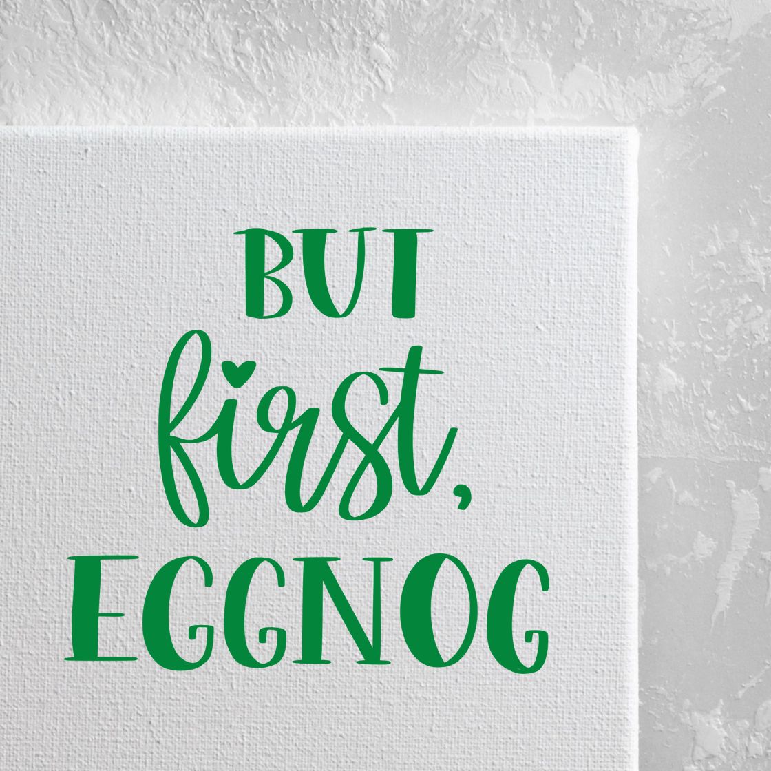 Custom rubber stamp design reading But first, eggnog in green for festive holiday cards, gifts, and crafts.