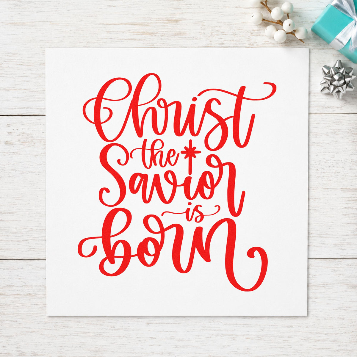 Christ The Savior Is Born rubber stamp shown in red ink, stamped for projects such as communion cup labels.