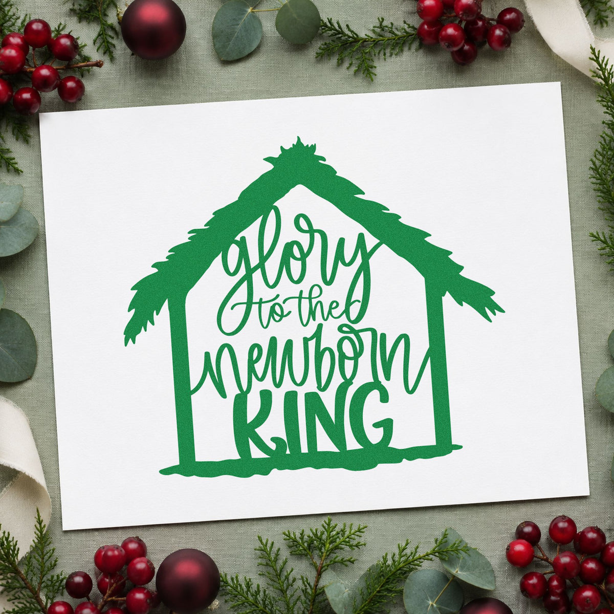 Glory To Newborn King craft stamp imprinted in green ink on paper, a design suited to framed fellowship hall.