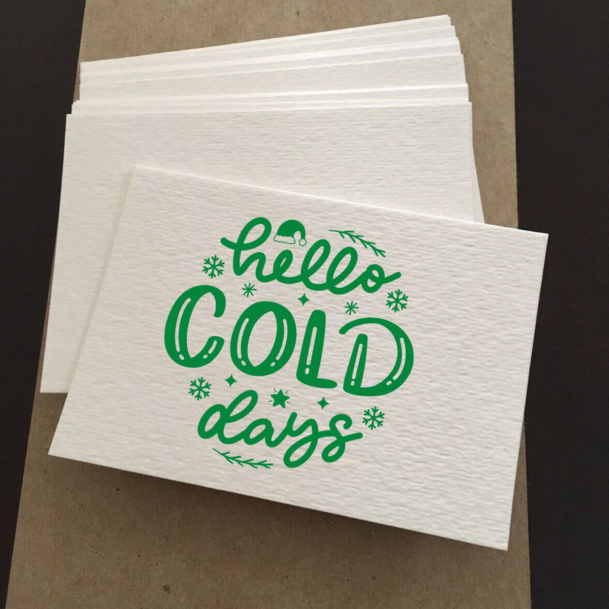 Custom winter rubber stamp design with hello cold days text and snowflakes, ideal for holiday paper crafting.