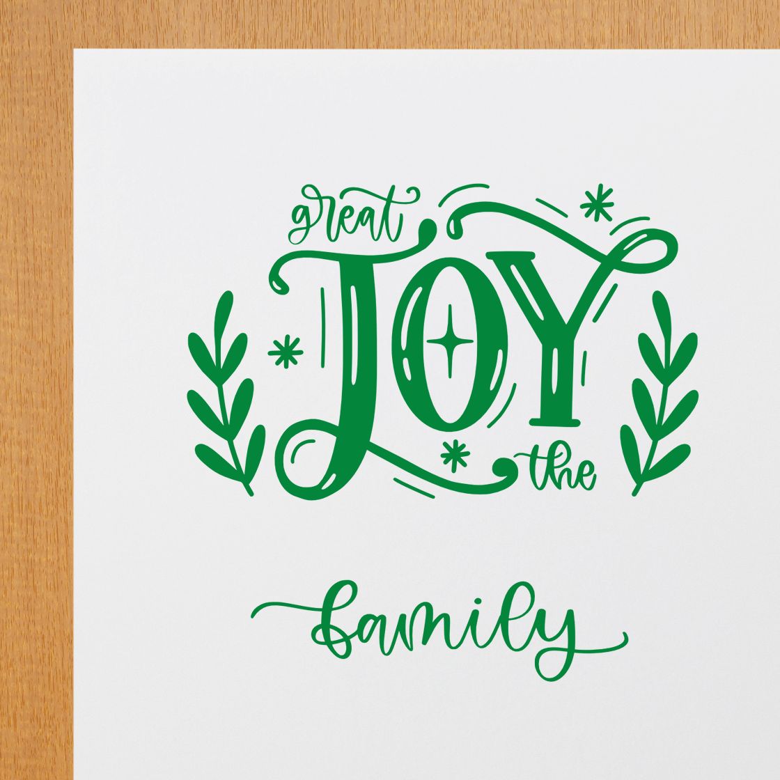 Festive Great Joy family rubber stamp design in green script for Christmas cards and holiday crafts.