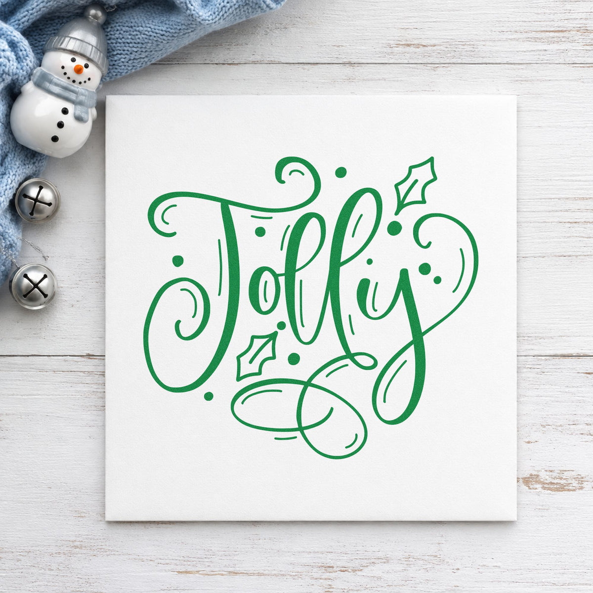 Jolly With Holly craft stamp imprint in green ink on a handmade project, one idea being bar sign placards.