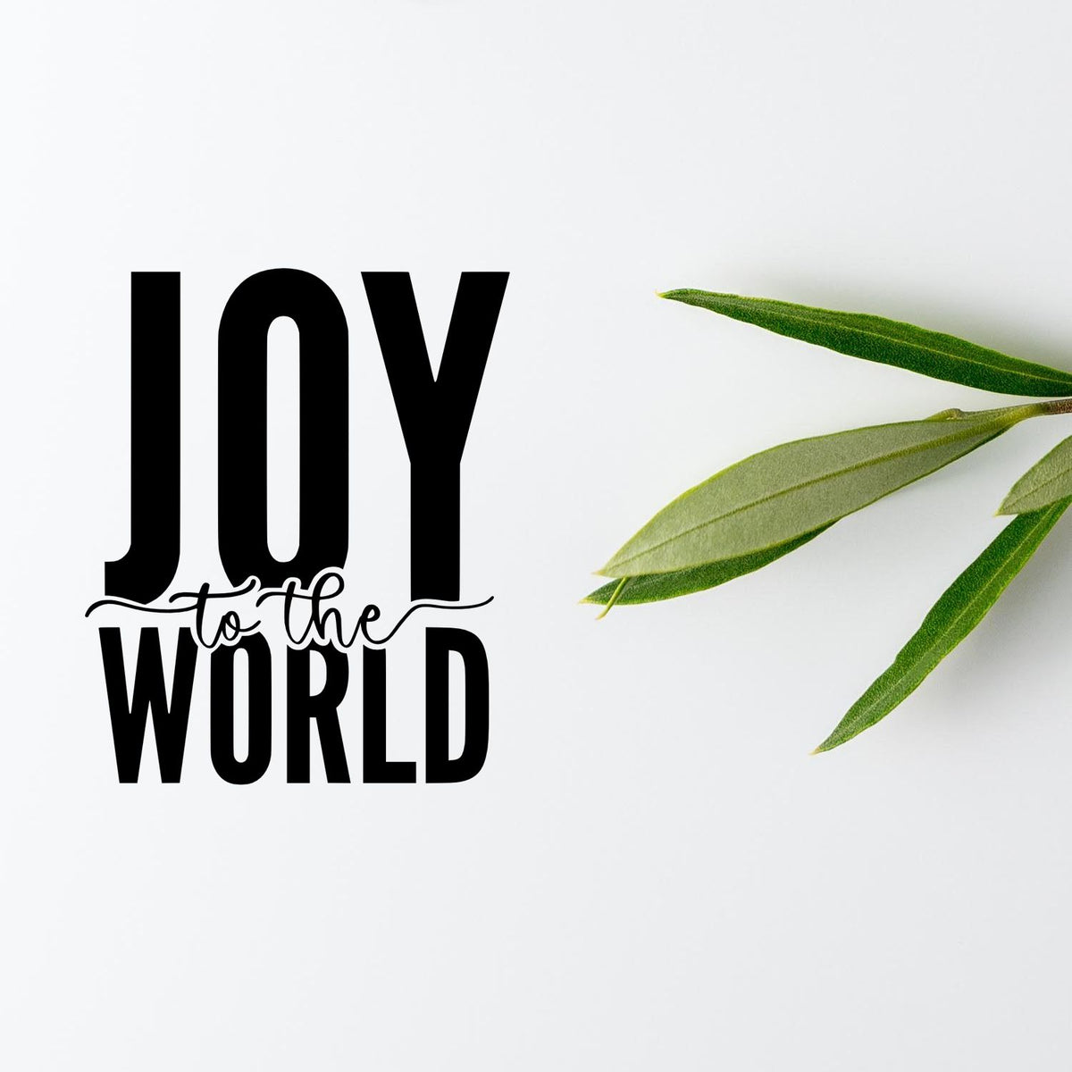 Joy to the World rubber stamp design with bold typography and green leaves on a white background.