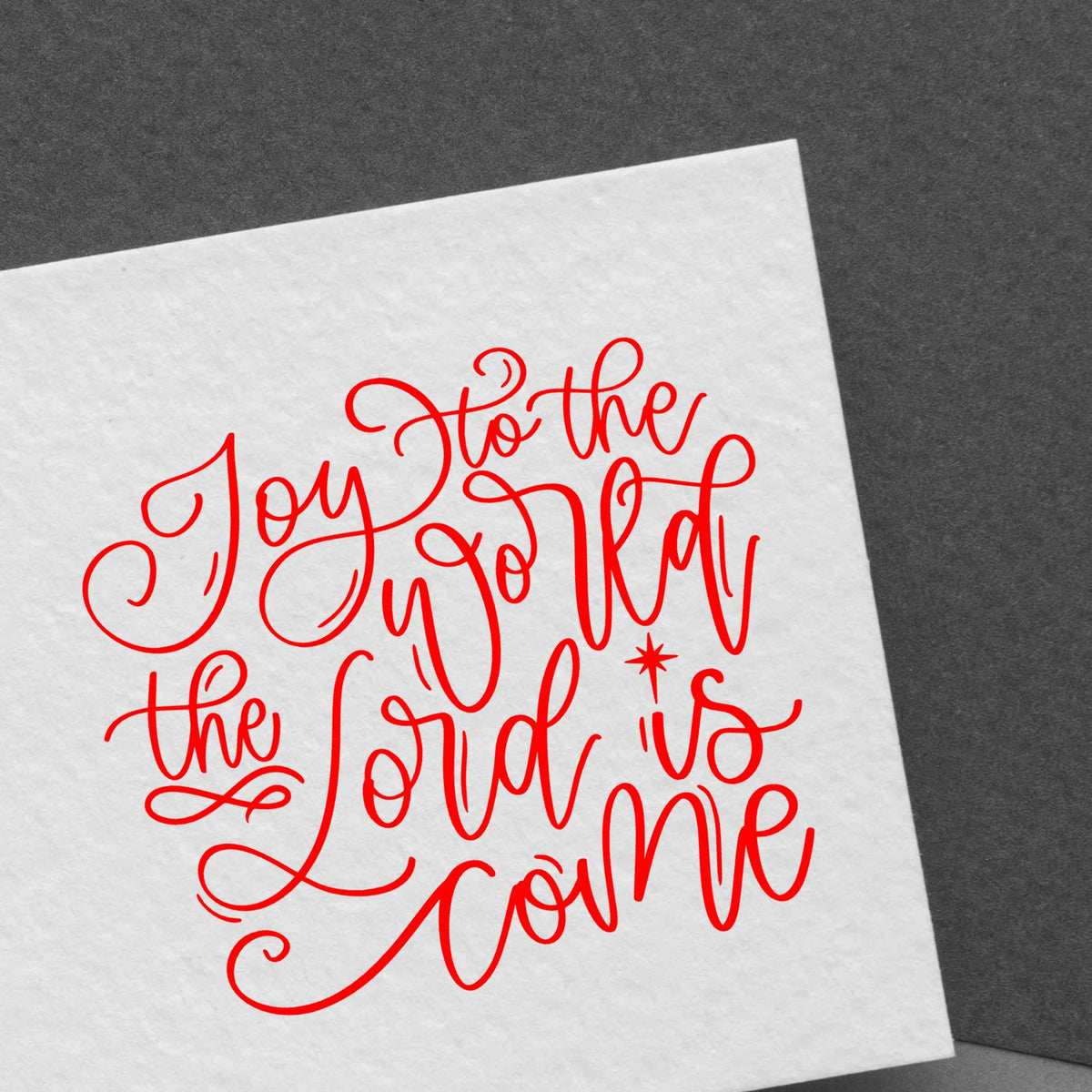 Red Joy to the World the Lord Is Come rubber stamp design on white paper, perfect for Christmas and holiday card making.