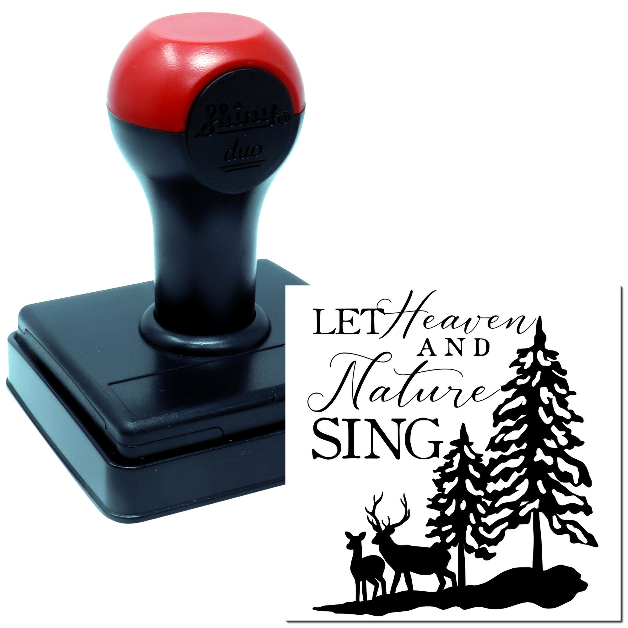 Self-inking rubber stamp with Let Heaven and Nature Sing pine tree and deer design for holiday crafting.