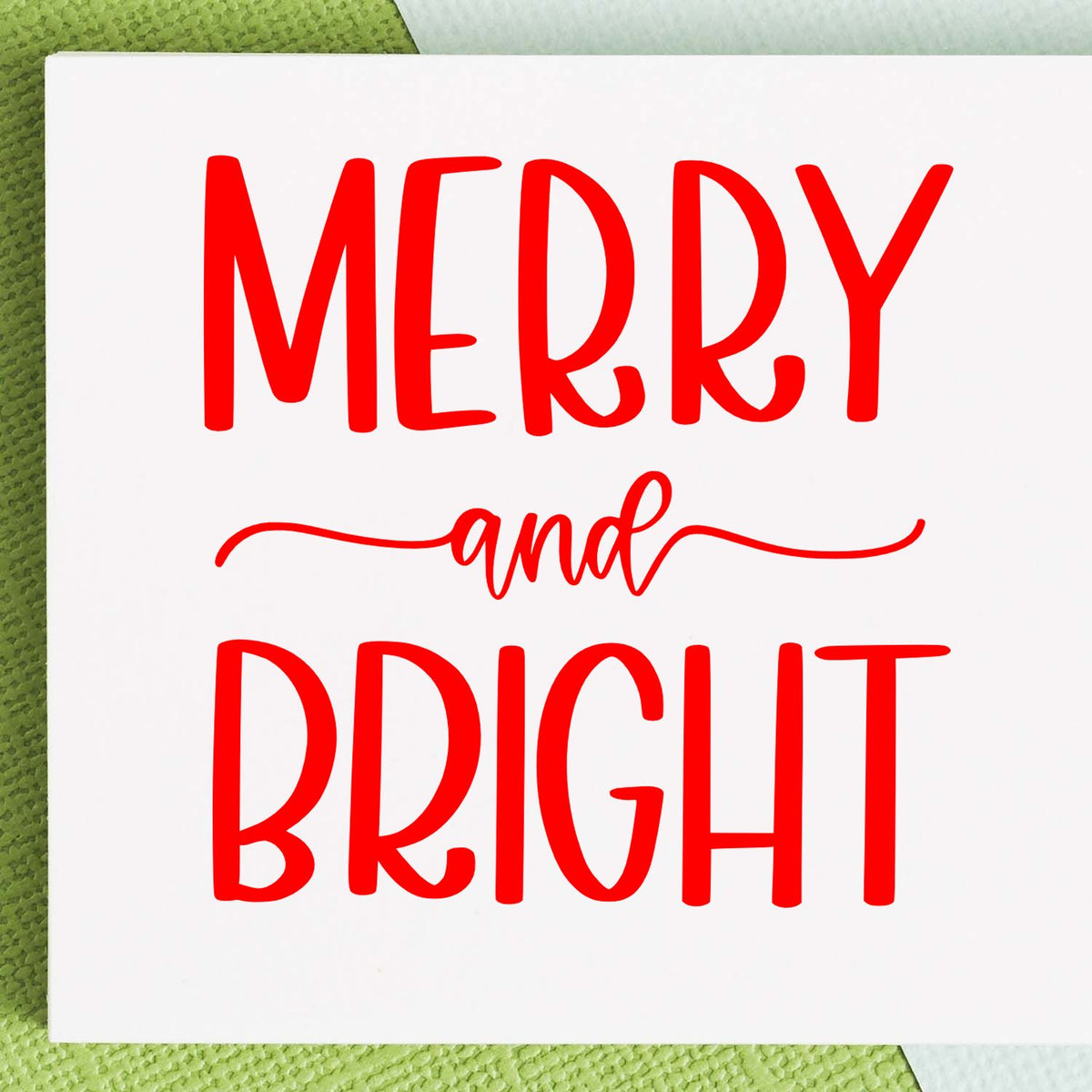Merry and Bright rubber stamp design with red festive lettering for Christmas cards, holiday crafts, and seasonal DIY projects.