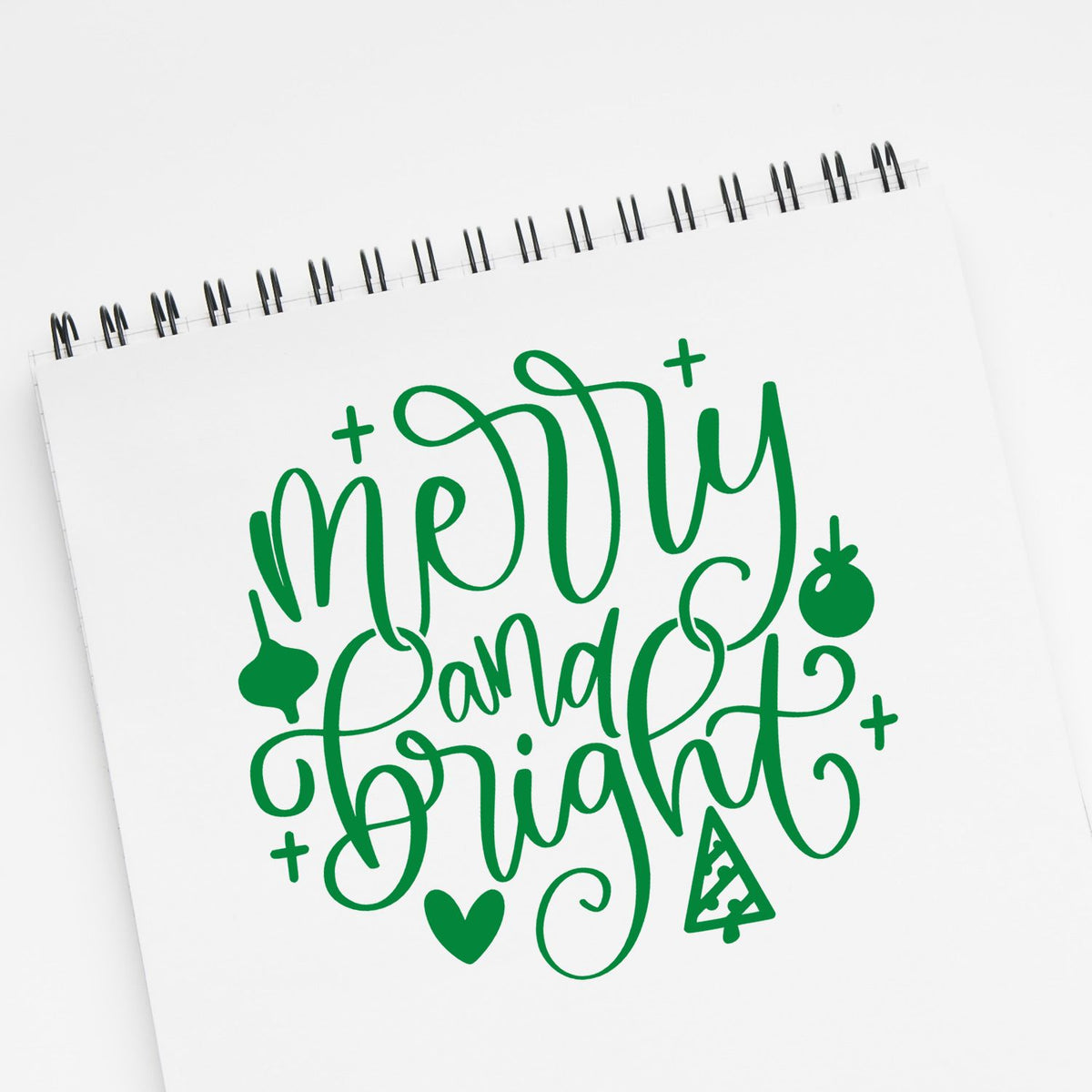Christmas rubber stamp with green Merry and Bright lettering and festive holiday accents