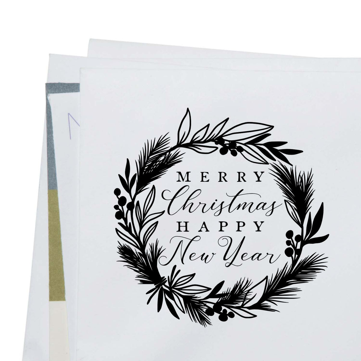 Botanical Wreath Holiday New Year Lettering Slim Pre-Inked Stamp imprint stamped in black ink. “Merry Christmas Happy New Year” sits inside a wreath of evergreen and leafy sprigs.
