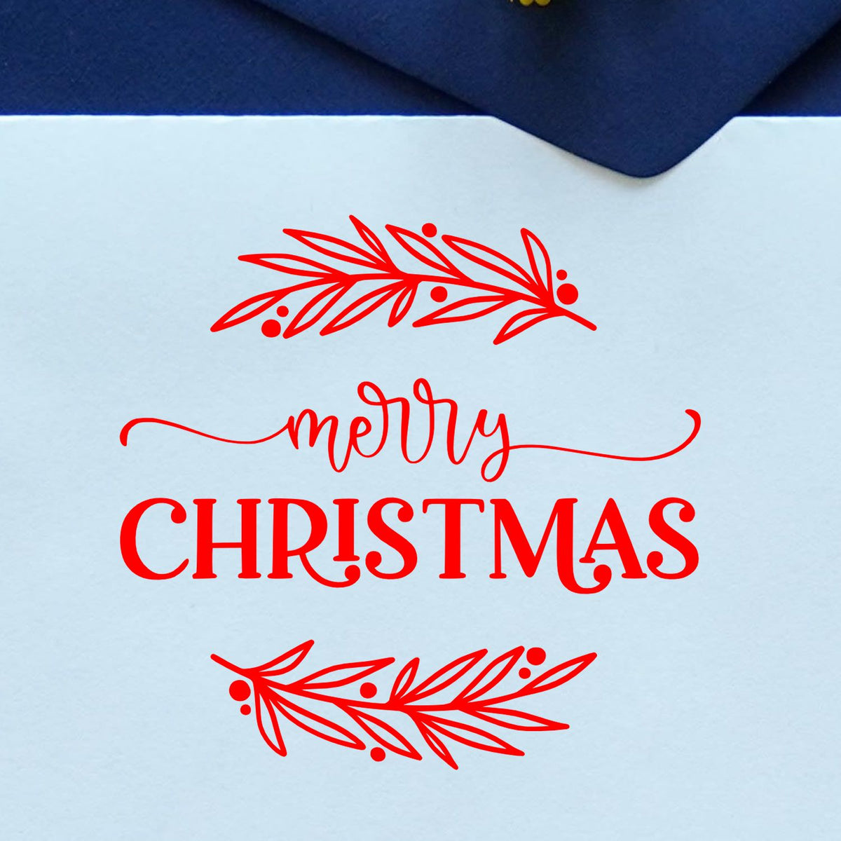 Merry Christmas rubber stamp design with festive branches and script lettering for holiday cards and crafts.