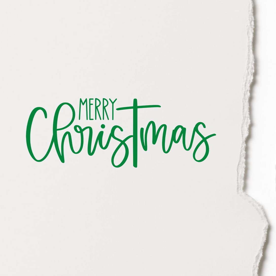 Merry Christmas rubber stamp design in green script, ideal for holiday cards, craft projects, and festive paper goods.