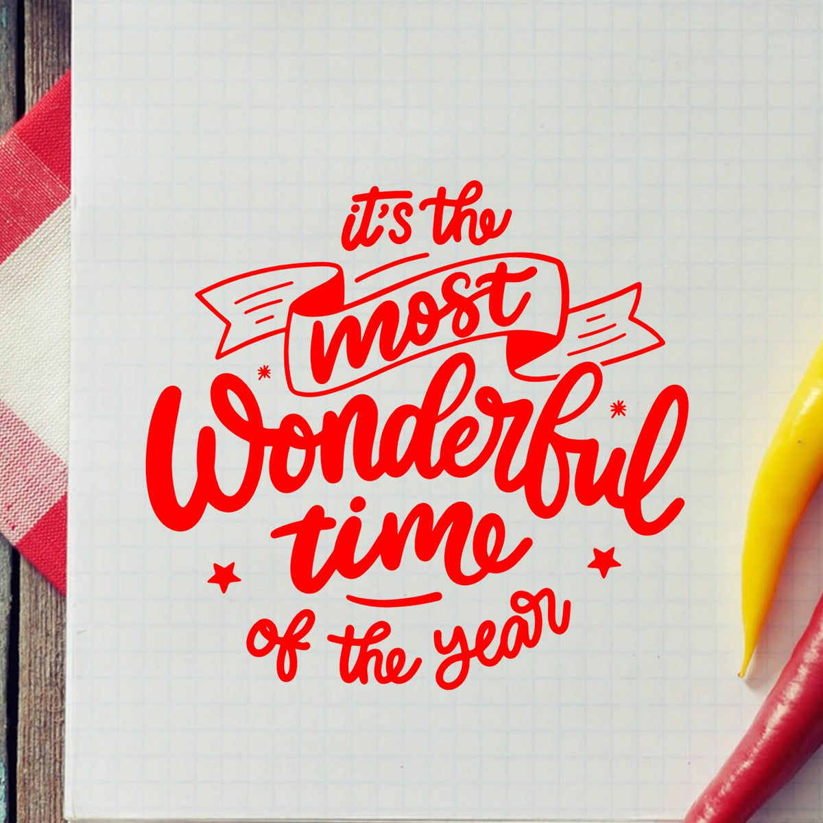 Holiday rubber stamp design reading Its the most wonderful time of the year in red script for cards, crafts and scrapbooking.