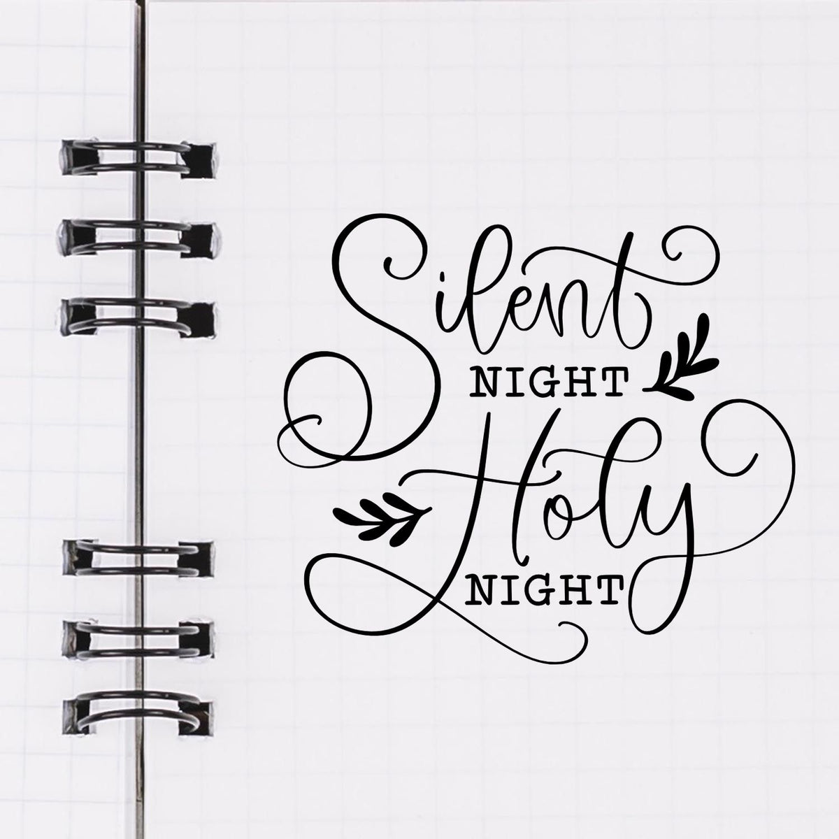 Premium Wooden Silent Night Holy Night Leaf Accents Stamp - Vintage Pro imprint stamped in black ink. "Silent Night Holy Night" uses ornate script with small leafy accents.