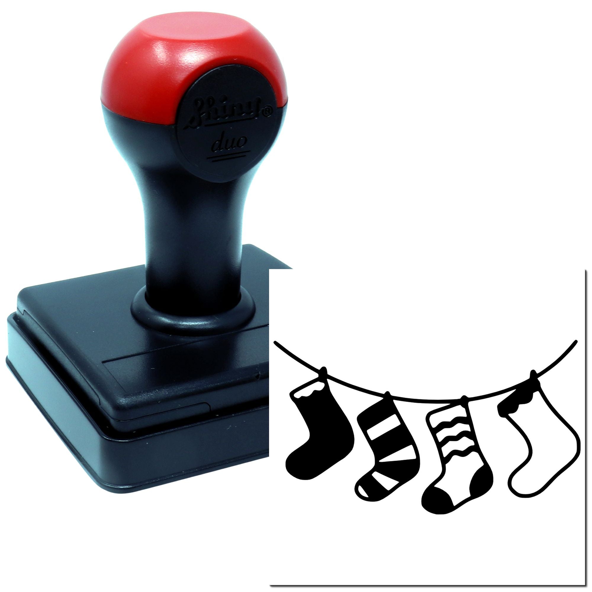Rubber stamp with hanging socks on a clothesline design, showing the custom imprint for craft and card making.
