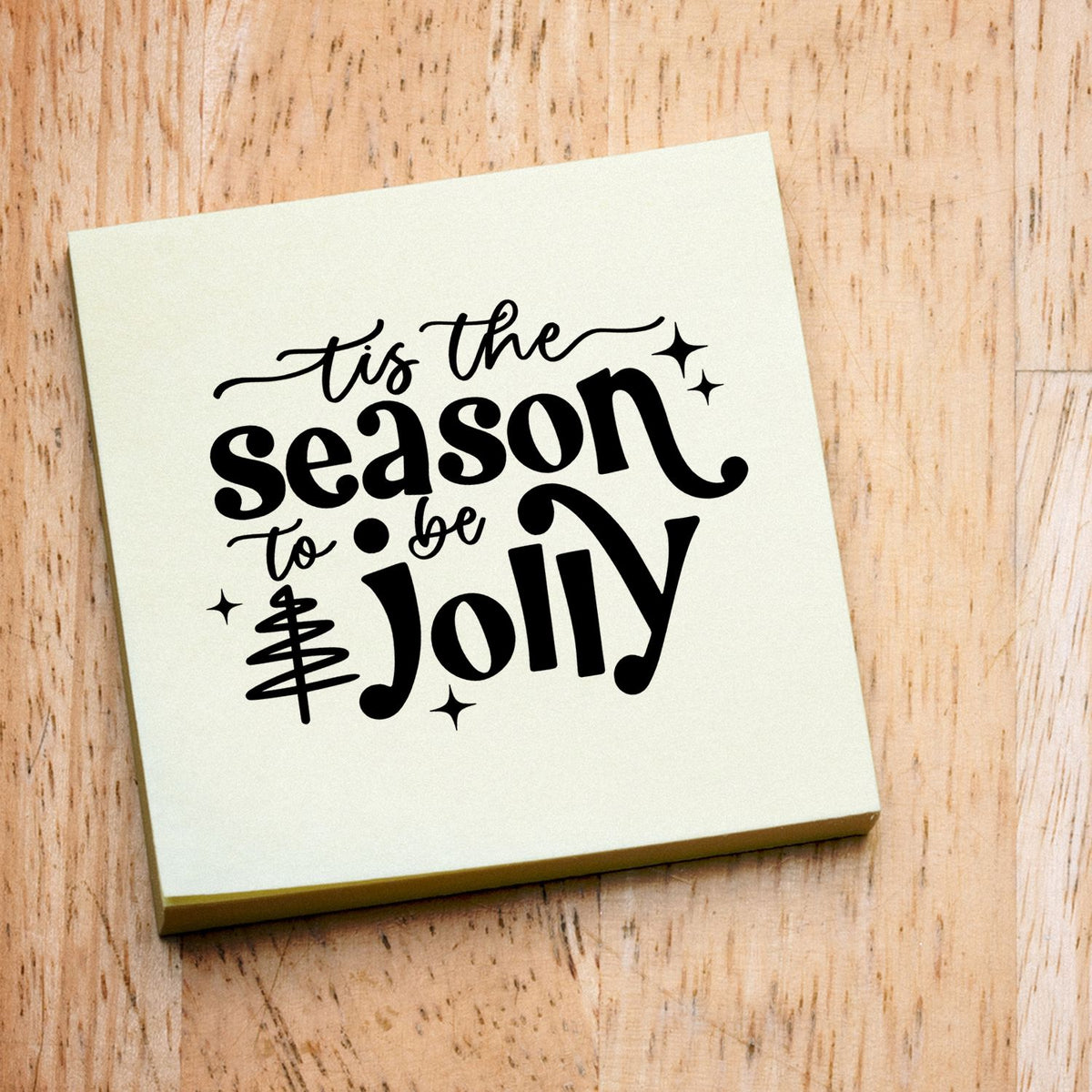 Christmas rubber stamp featuring Tis the Season to Be Jolly design on a wood block