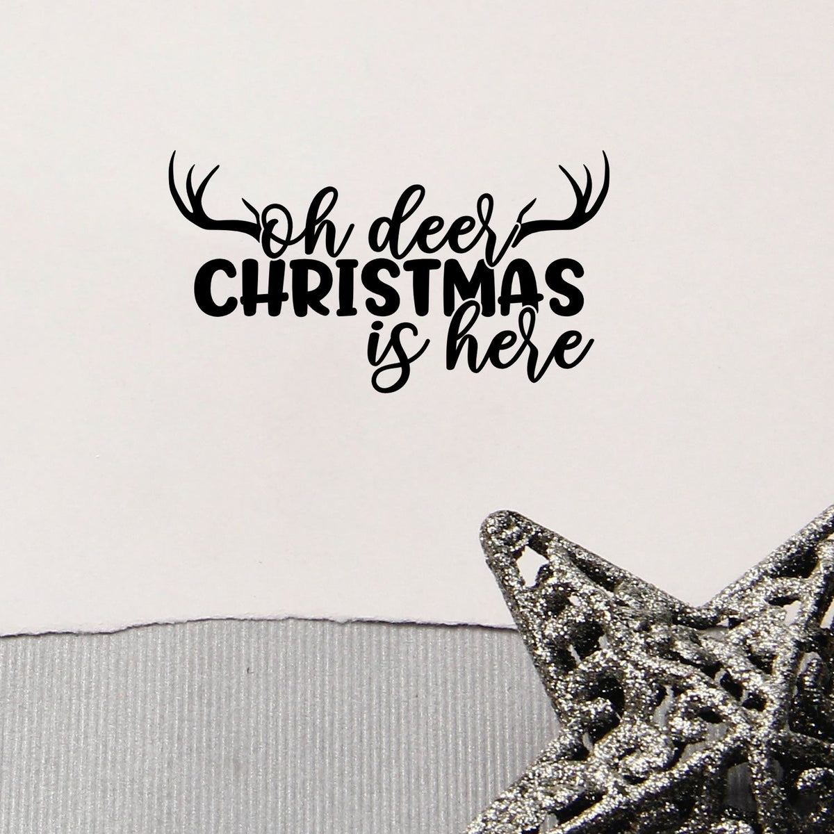 Oh Deer Christmas Is Here Pre-Inked Stamp – PSI imprint stamped in blue ink. “Oh Deer Christmas Is Here” is topped by large antlers.