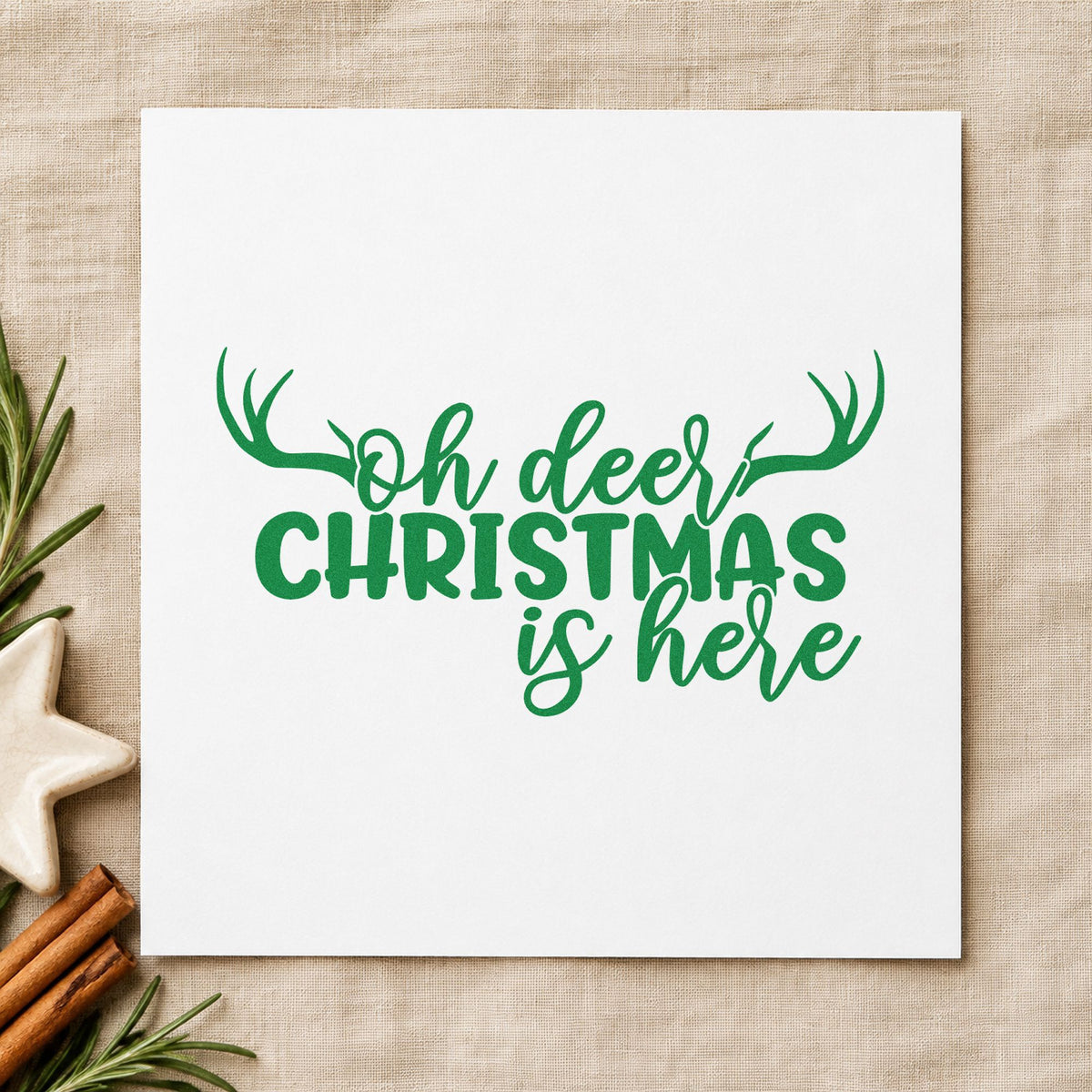 Oh Deer Christmas Is Here craft stamp imprint in green ink on a handmade project, one idea being late party invites.