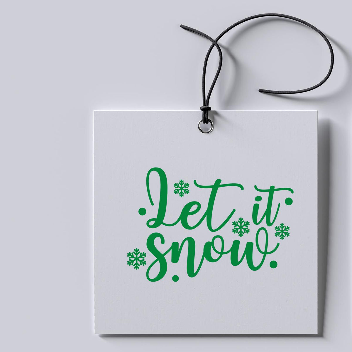 Let It Snow Snowflakes rubber stamp shown in green ink, stamped for projects such as skating album page.