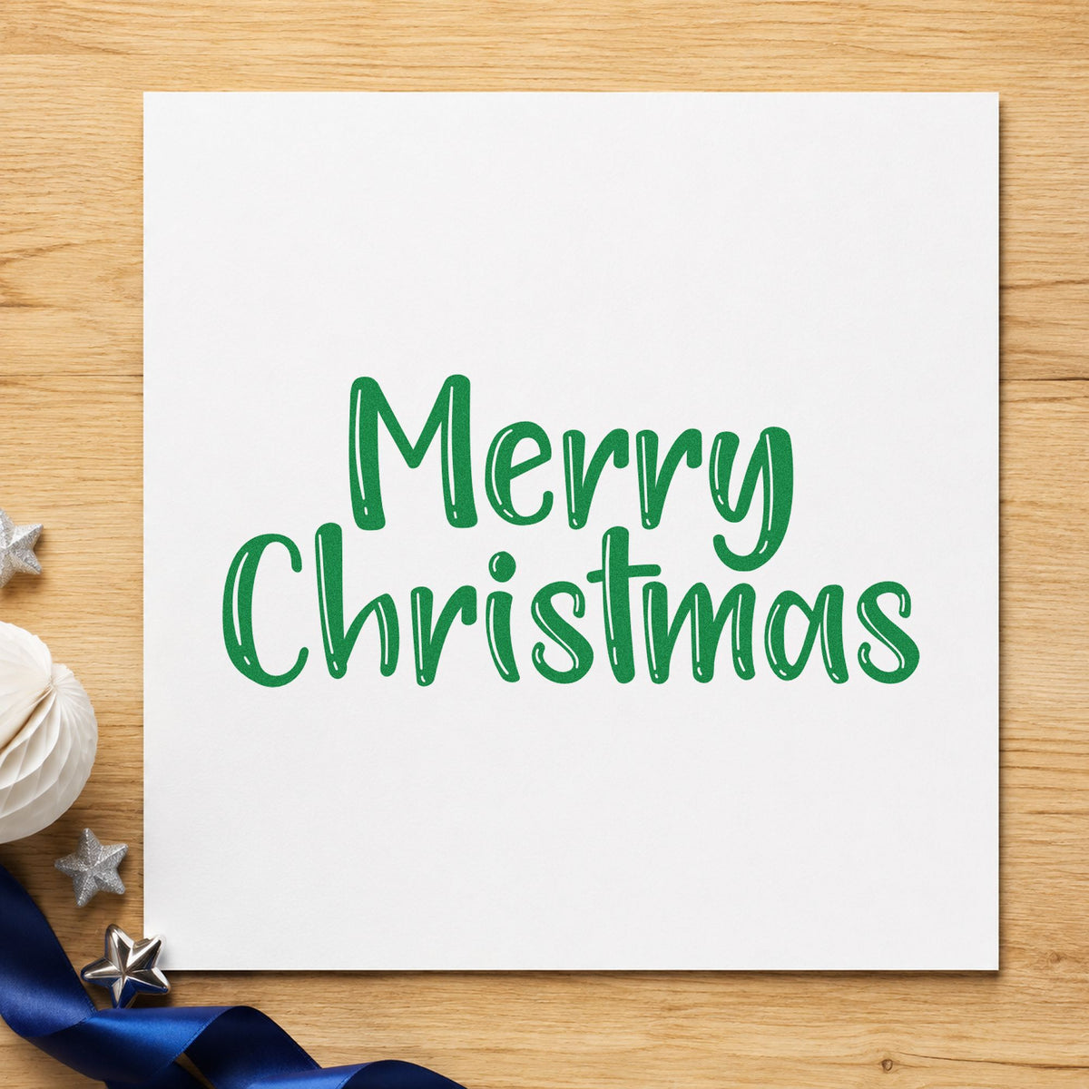 Merry Christmas Textured Letters craft stamp imprint in green ink on a handmade project, one idea being twine tied tags.