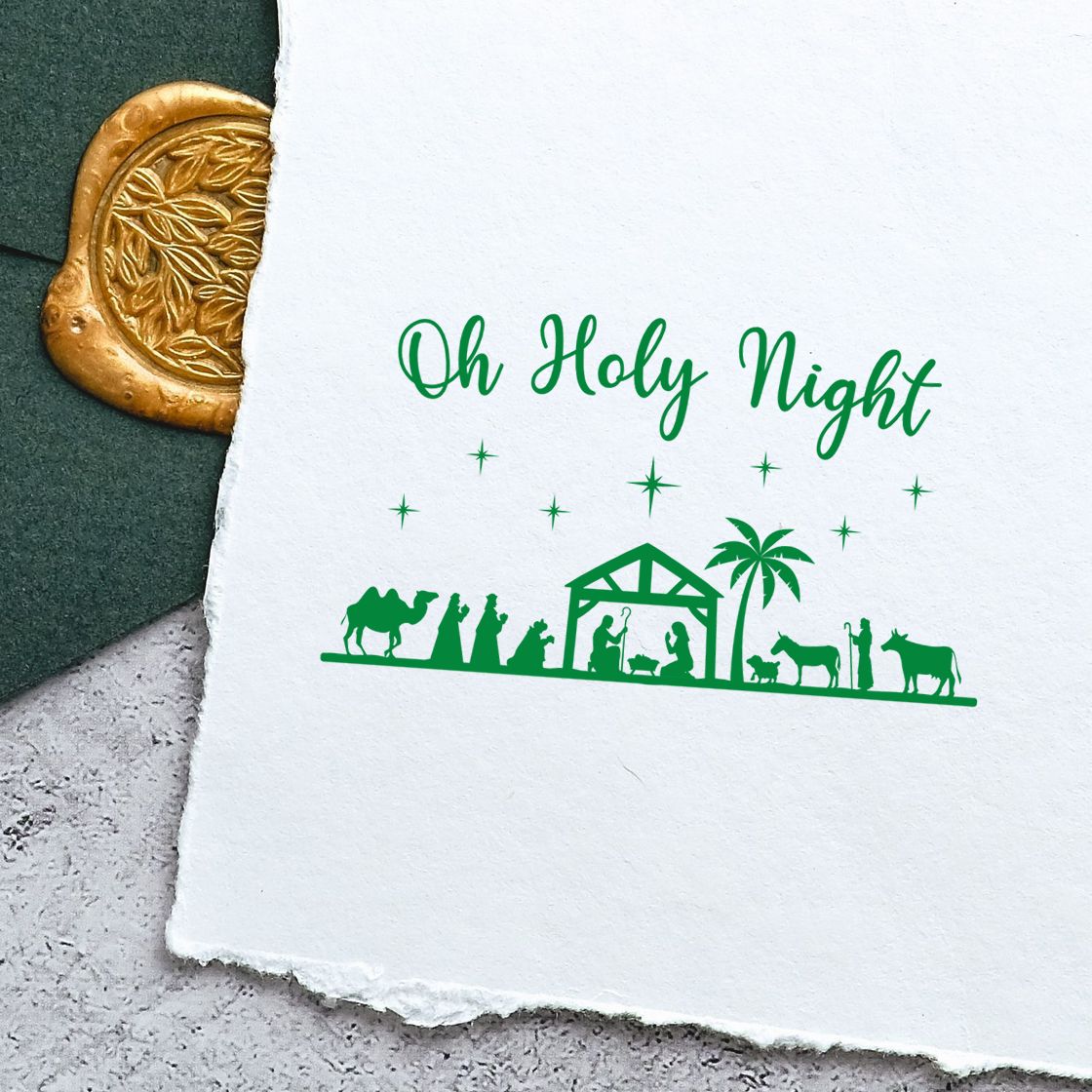 Oh Holy Night nativity Christmas rubber stamp design with green silhouette, stars, and manger scene on paper