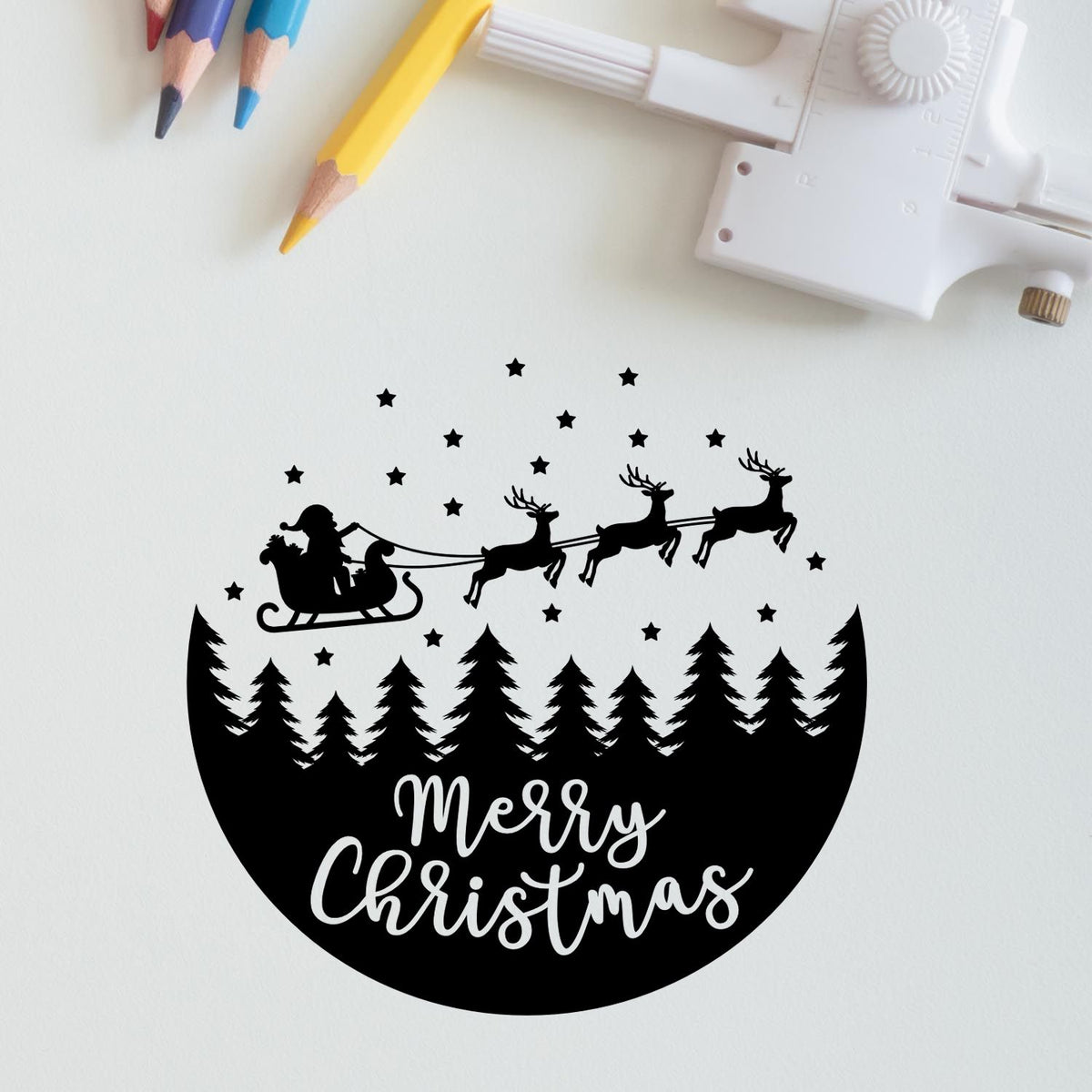 Merry Christmas Sleigh Forest Circle Pre-Inked Stamp – PSI imprint stamped in black ink. A circular design combines Santa's sleigh, reindeer, stars, pine trees, and script “Merry Christmas.”