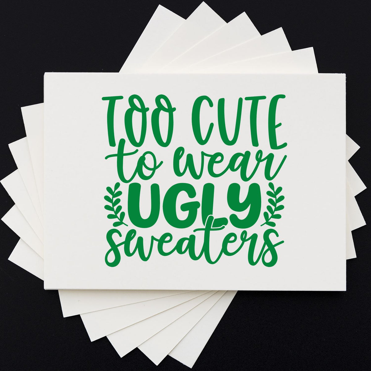 Too Cute Wear Ugly Sweaters rubber stamp shown in green ink, stamped for projects such as dorm room album page.