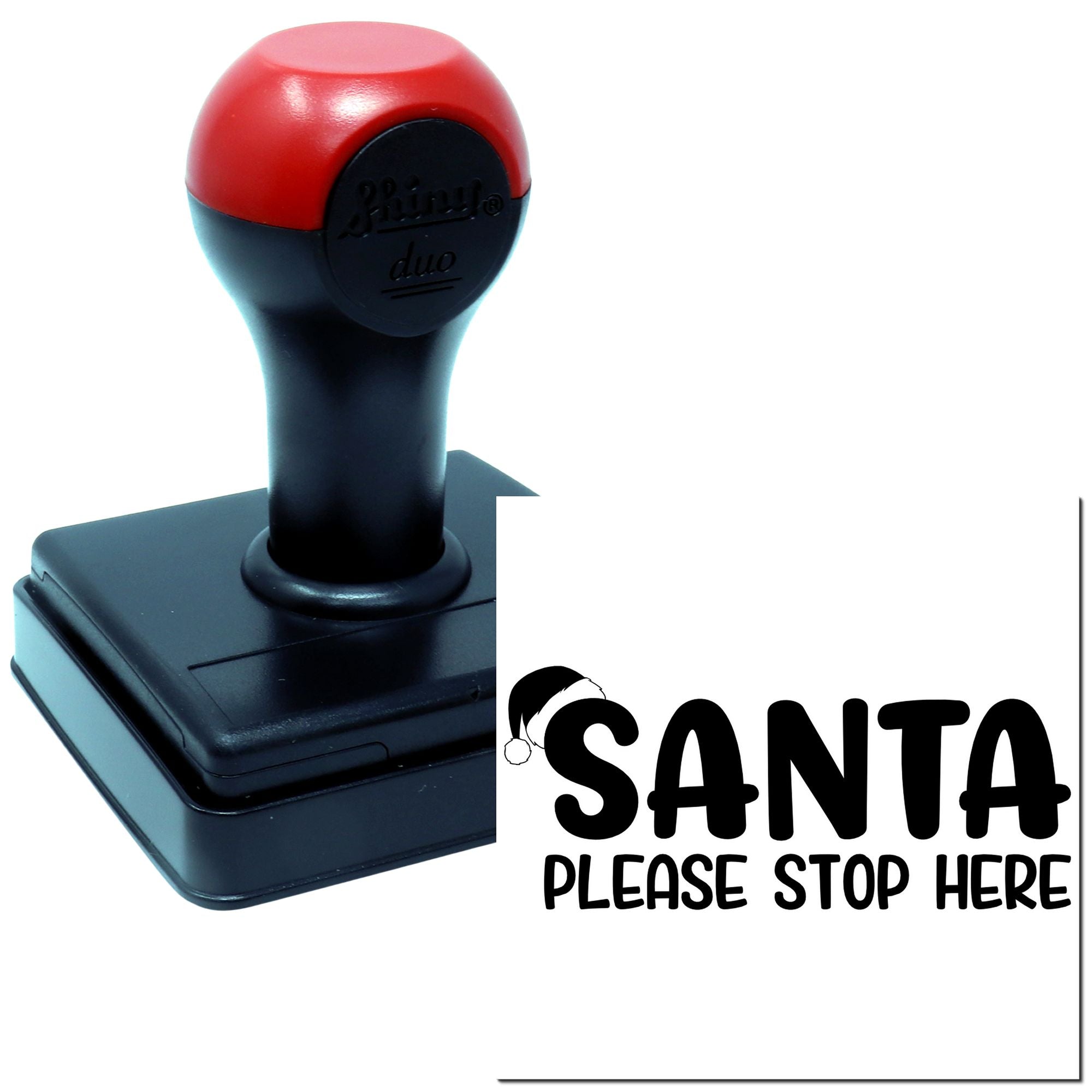 Self-inking rubber stamp with Santa Please Stop Here holiday message for Christmas mail and gift labeling.