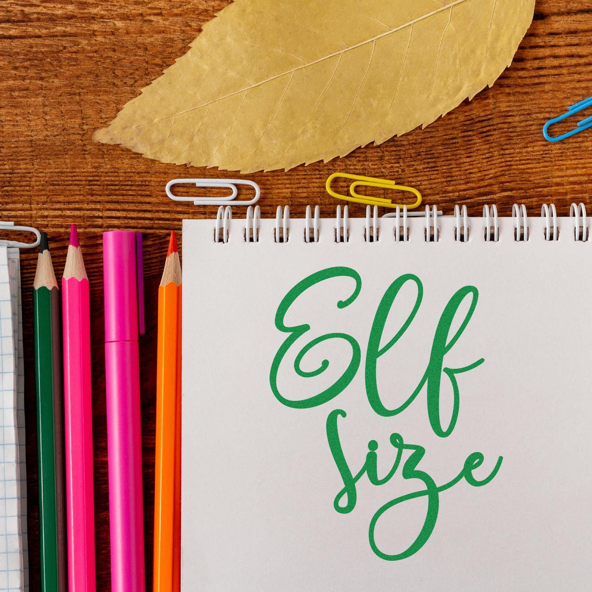 Elf Size Script rubber stamp shown in brown ink, stamped for projects such as kids growth album.
