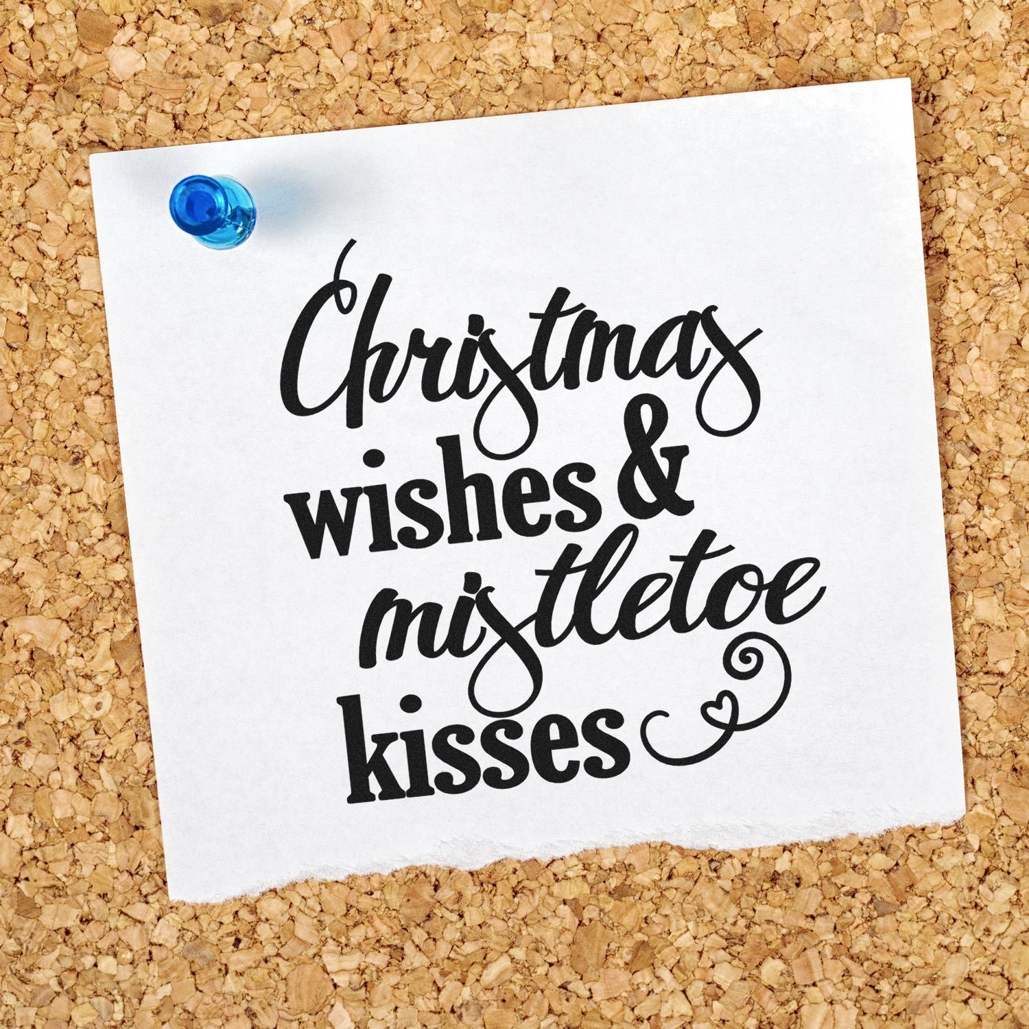 Christmas wishes & mistletoe kisses rubber stamp design on pinned paper, perfect for holiday cards and festive DIY crafts.