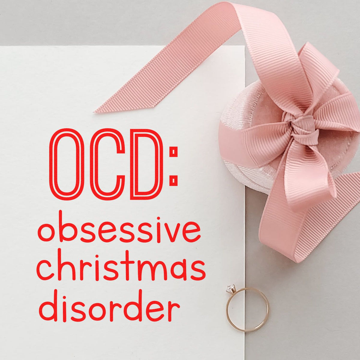 OCD: Obsessive Christmas Disorder rubber stamp design with pink gift ribbon and bow on a white card.