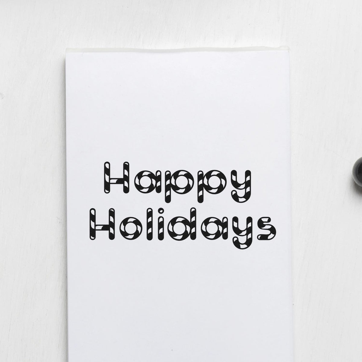 Happy Holidays Patterned Letters Block Lettering Pre-Inked Stamp – Slim imprint stamped in black ink. “Happy Holidays” appears in rounded capitals filled with festive patterns.