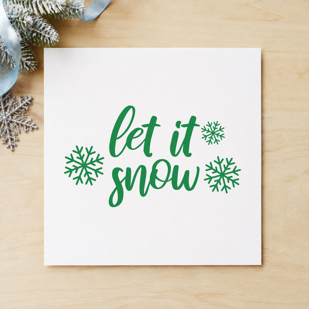 Let It Snow Three Snowflakes craft stamp imprint in green ink on a handmade project, one idea being fat quarter tags.