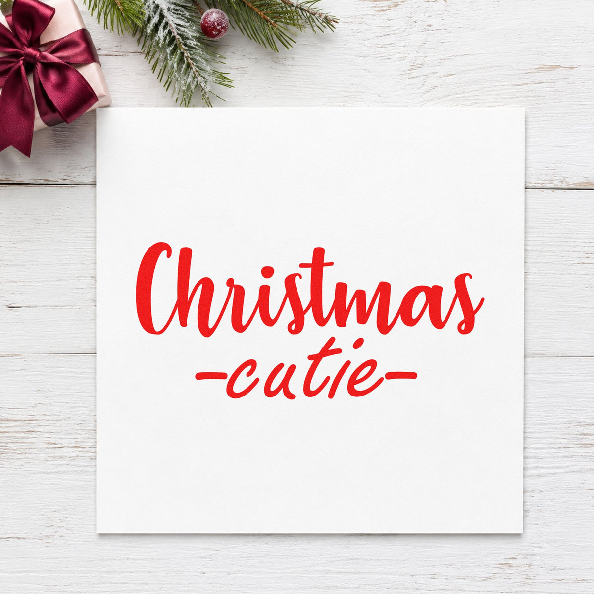 Christmas Cutie Script craft stamp in red ink on cardstock, an easy option for ruffle dress ink.
