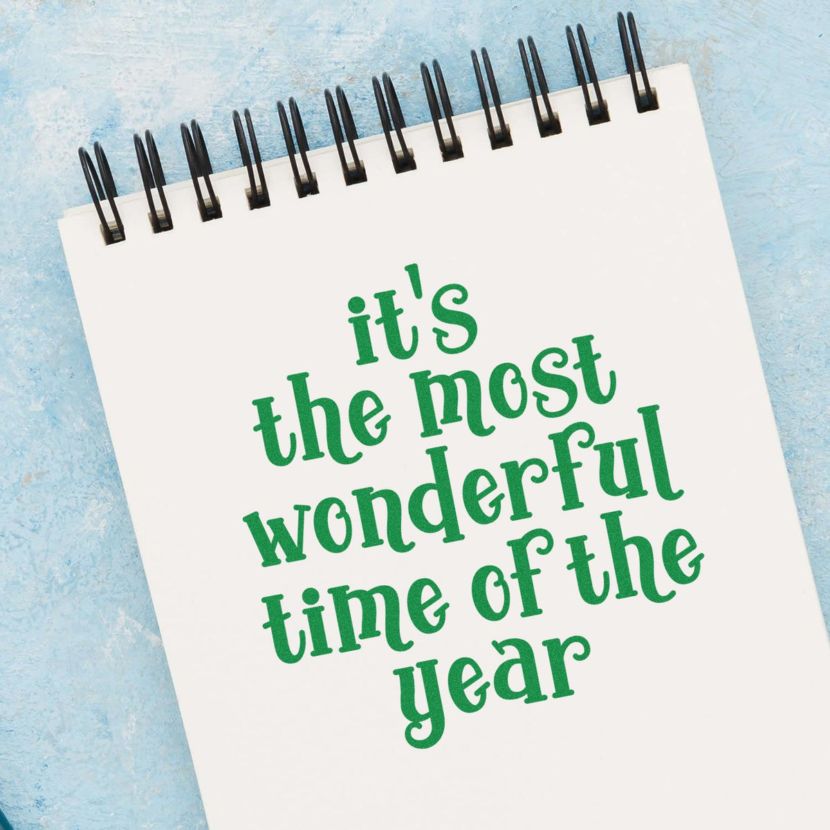 Most Wonderful Time Of Year rubber stamp shown in green ink, stamped for projects such as travel album page.